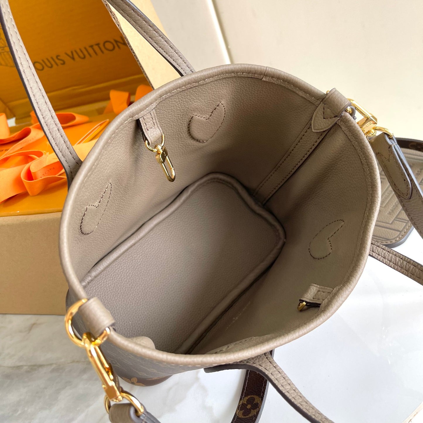Louis Vuitton Taupe Leather Bucket Handbag with Top Handles and Shoulder Strap