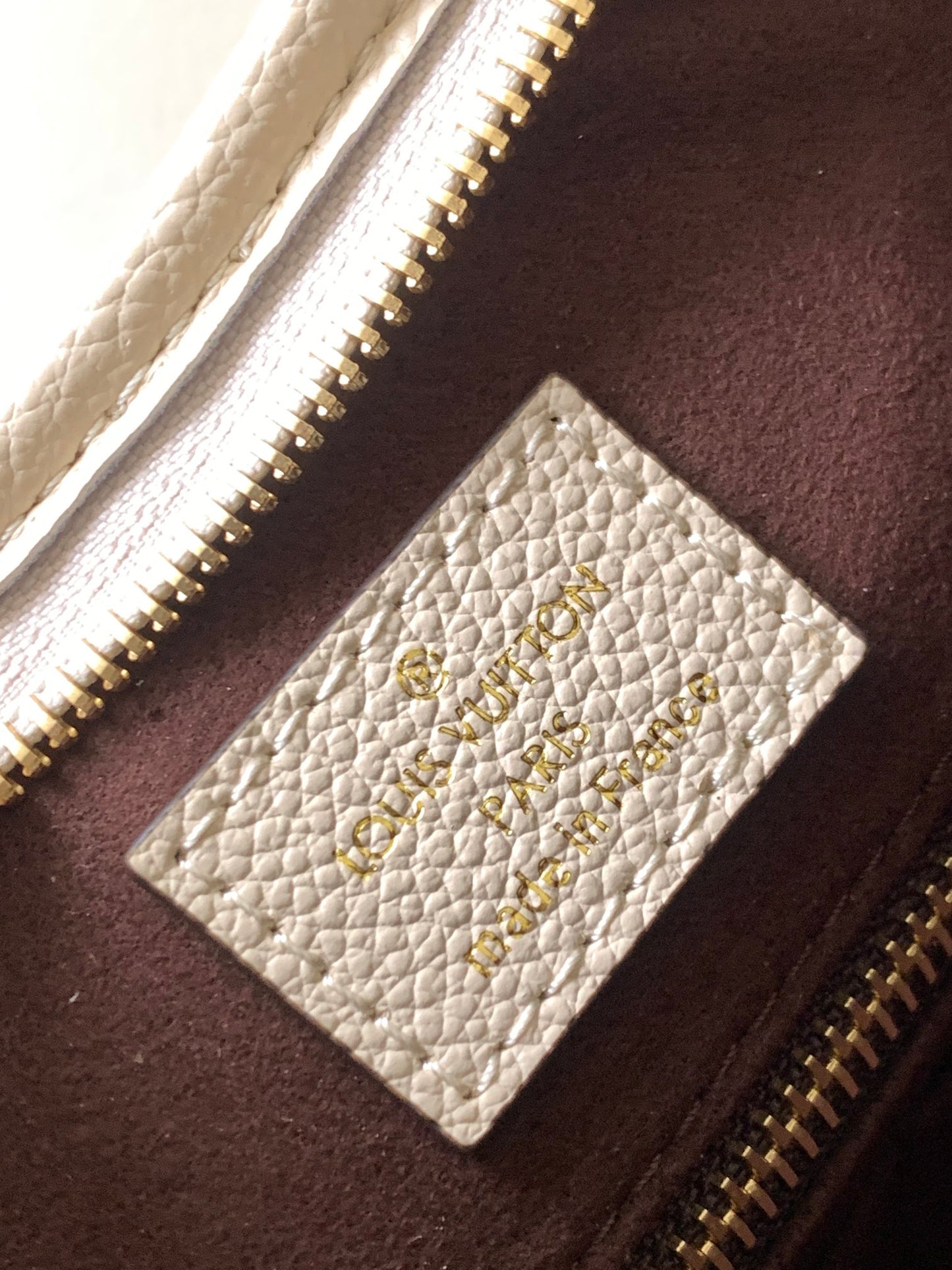 Louis Vuitton Elegant Beige Embossed Leather Shoulder Bag with Hanging Tag