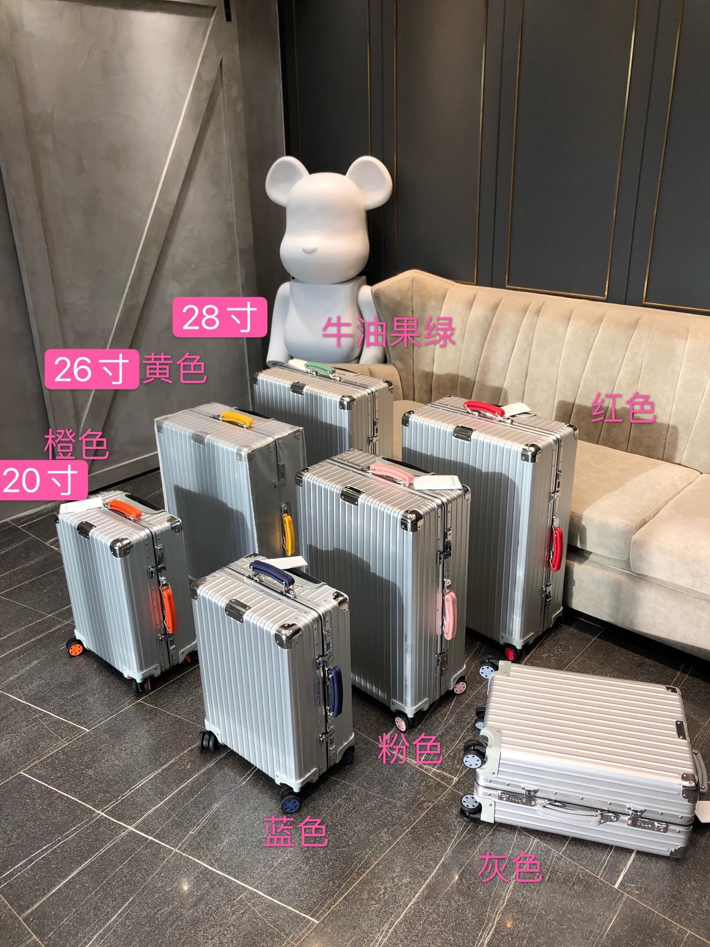 Silver Hardside Spinner Luggage with Pink Wheels and Handle