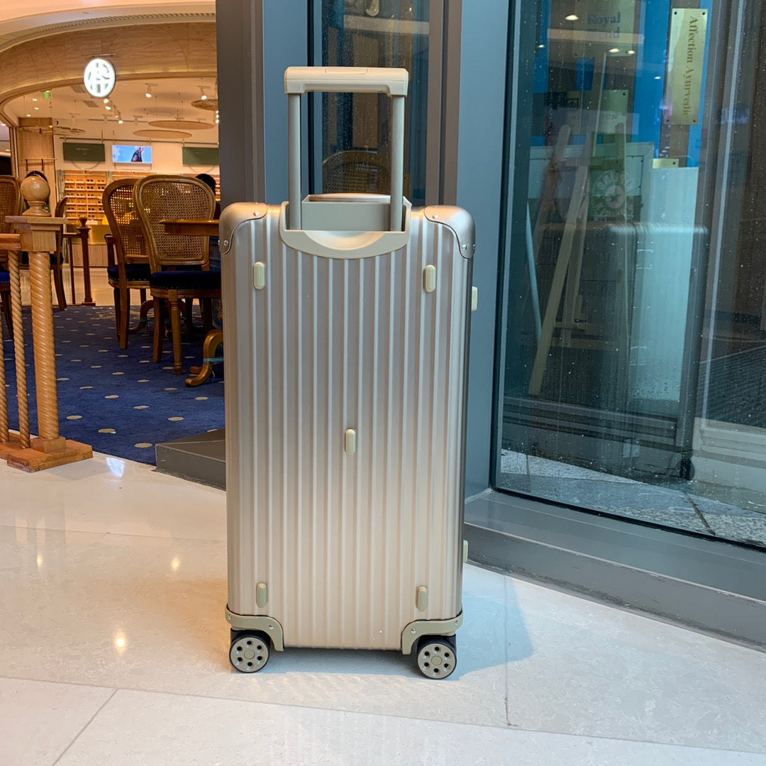 Champagne Gold Ribbed Hardside Spinner Luggage Suitcase