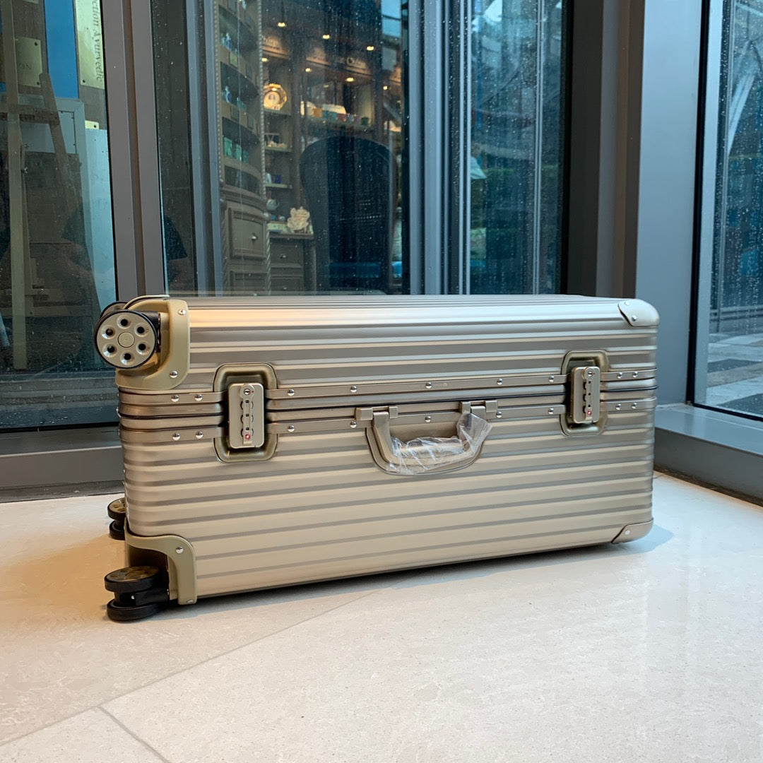 Champagne Gold Ribbed Hardside Spinner Luggage Suitcase
