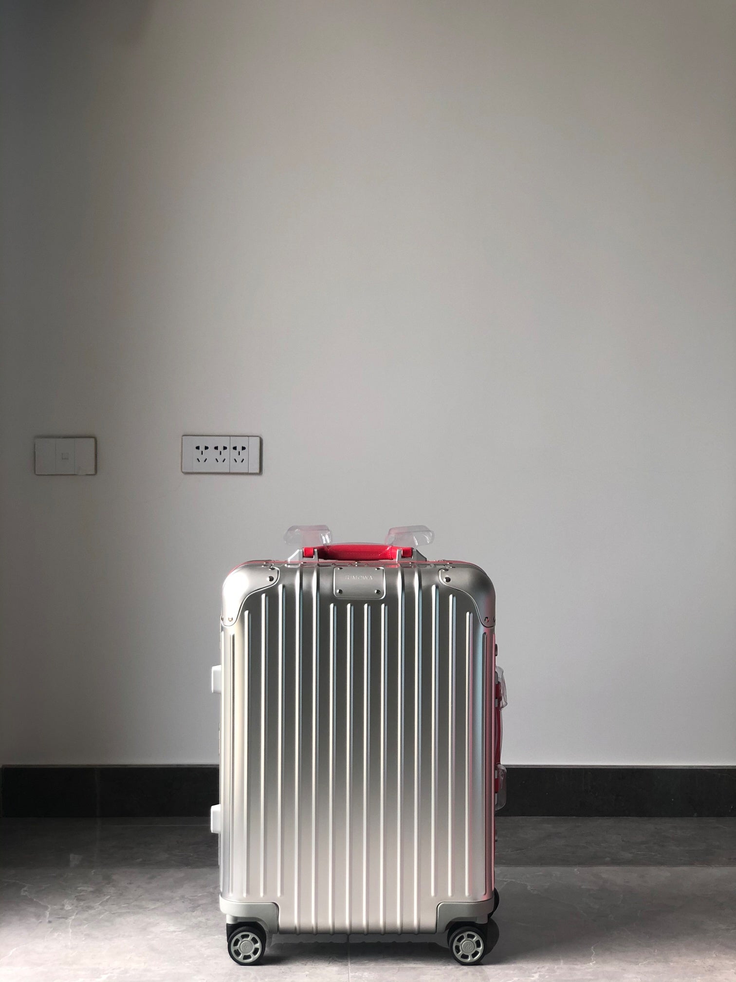 Silver Metallic Hardside Spinner Suitcase with Pink Accent