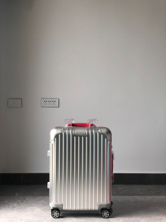 Silver Metallic Hardside Spinner Suitcase with Pink Accent