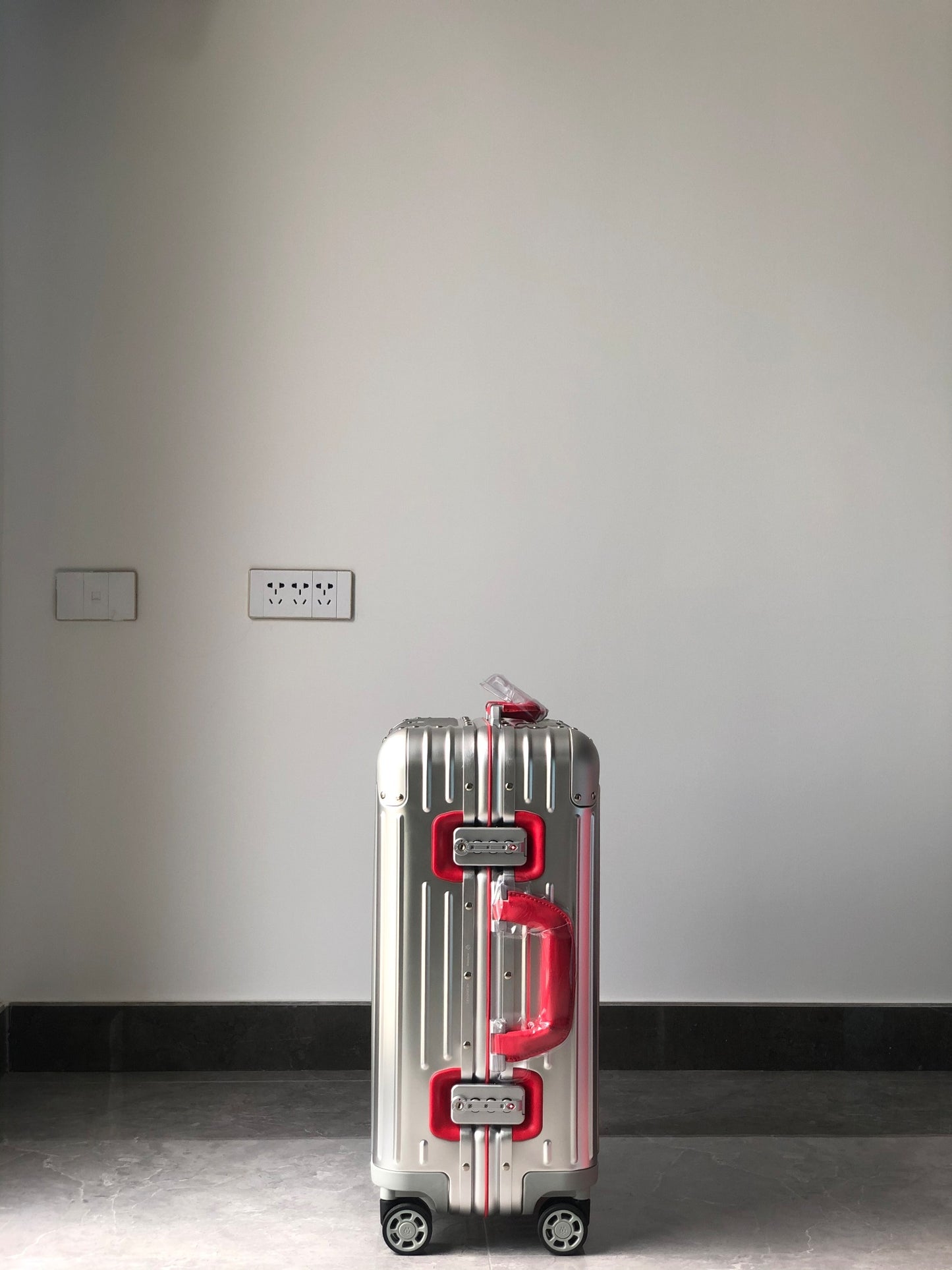 Silver Metallic Hardside Spinner Suitcase with Pink Accent