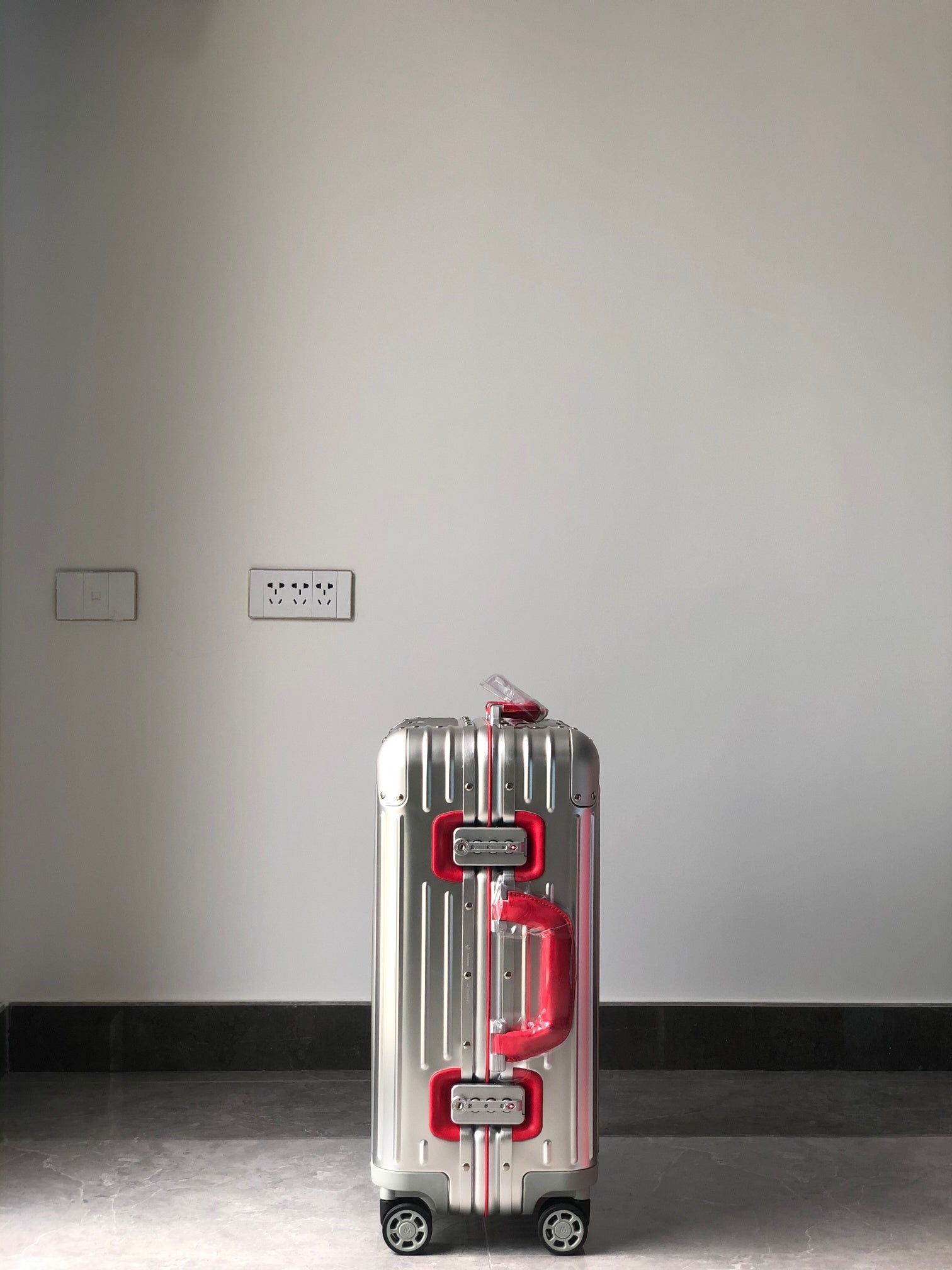 Silver Metallic Hardside Spinner Suitcase with Pink Accent