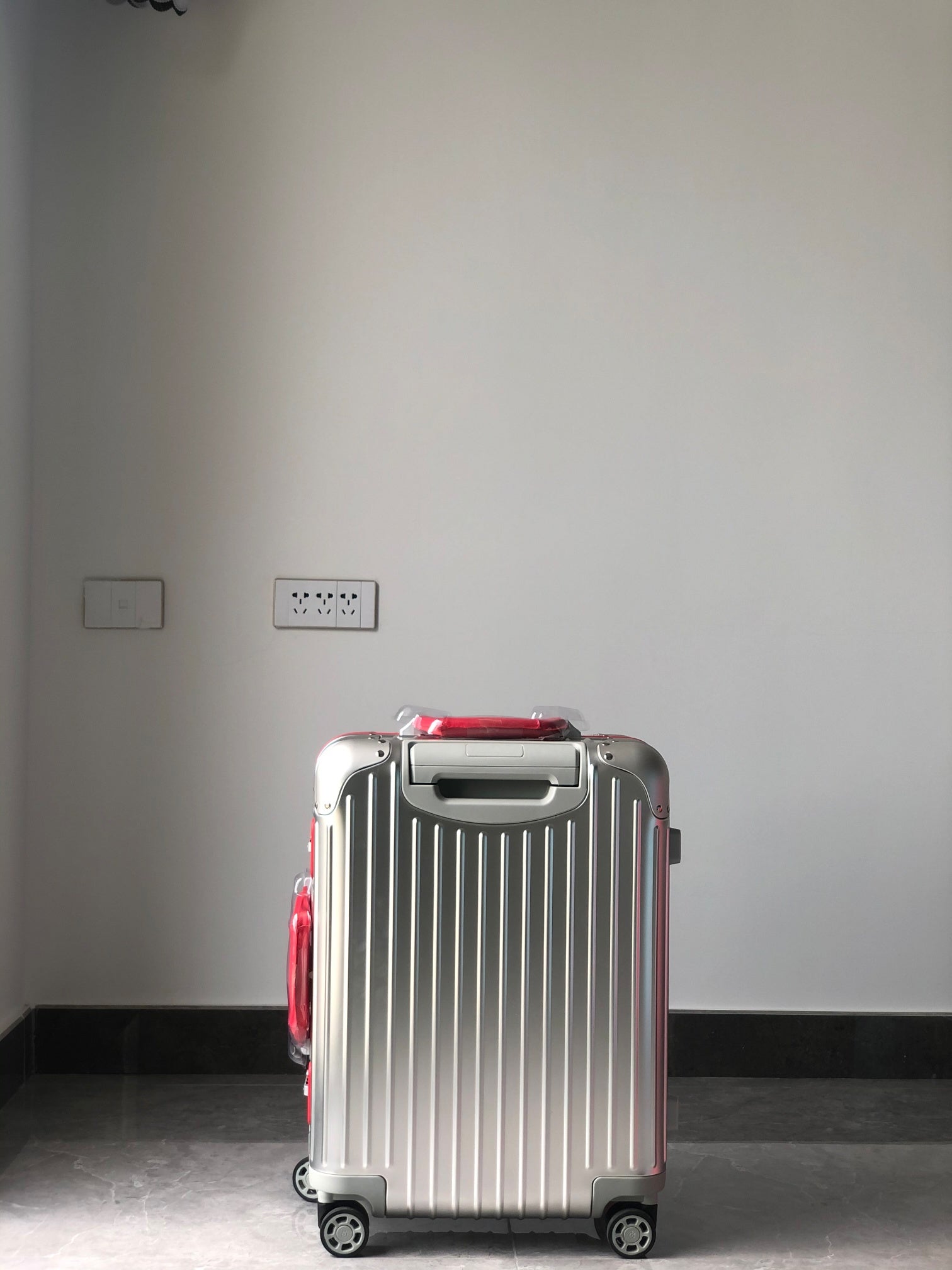 Silver Metallic Hardside Spinner Suitcase with Pink Accent