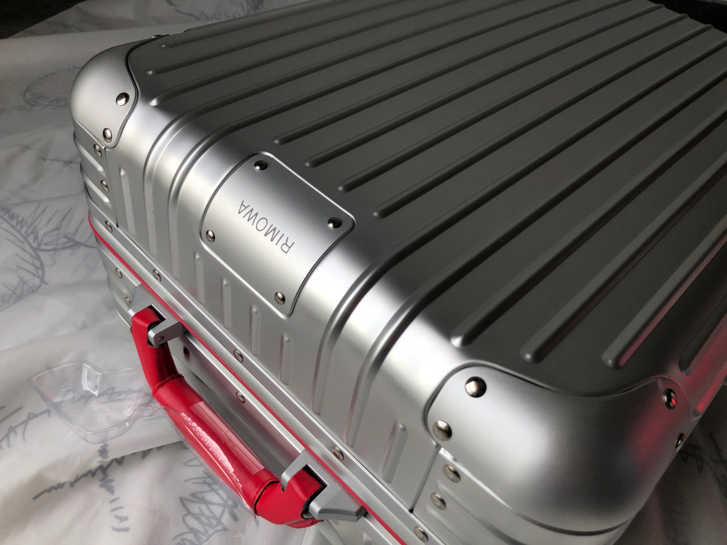 Silver Metallic Hardside Spinner Suitcase with Pink Accent
