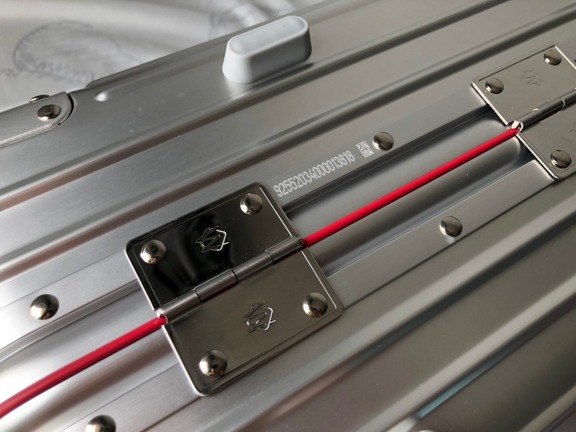 Silver Metallic Hardside Spinner Suitcase with Pink Accent