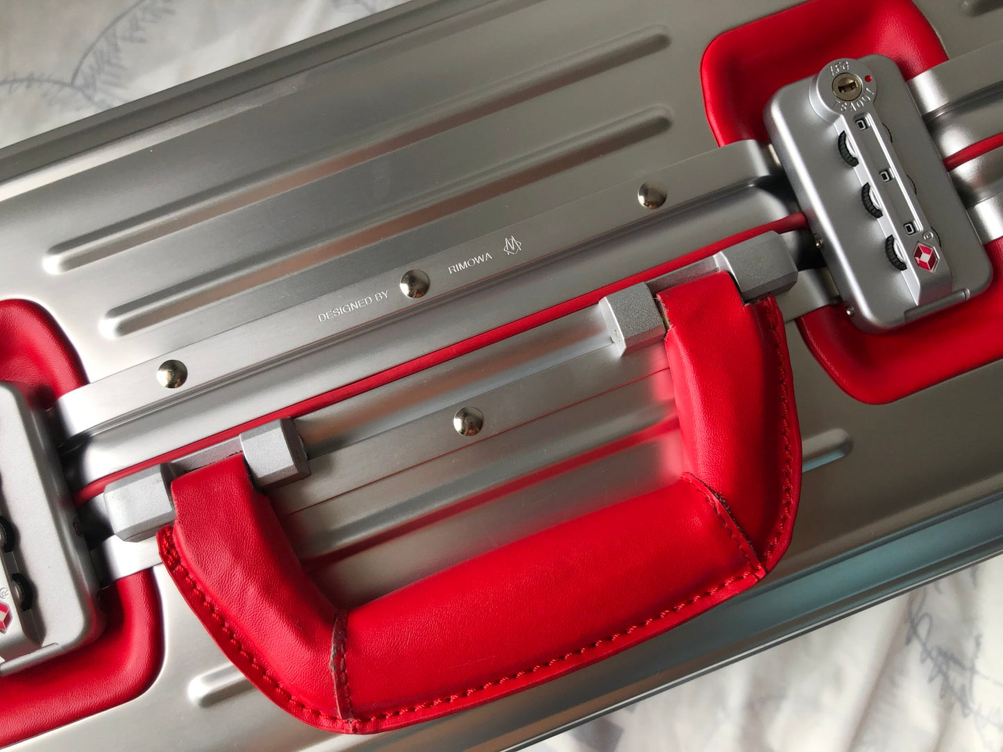 Silver Metallic Hardside Spinner Suitcase with Pink Accent
