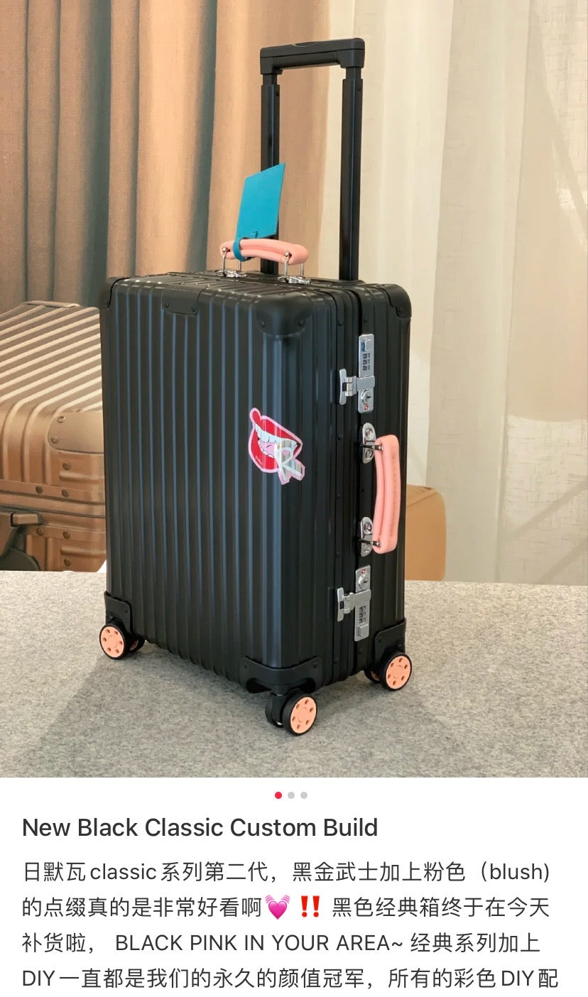 Matte Black Ribbed Hardside Spinner Suitcase with Orange Accents