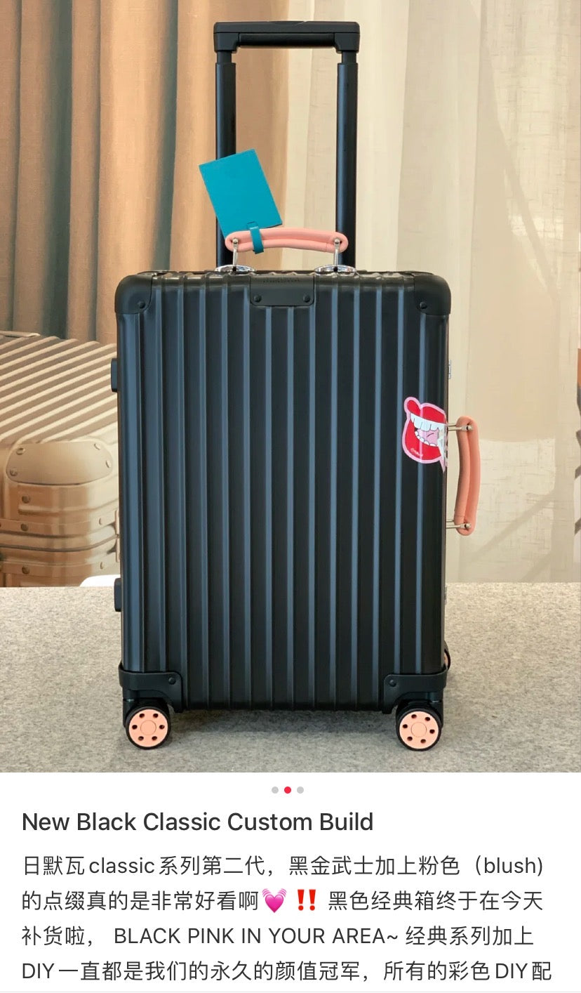 Matte Black Ribbed Hardside Spinner Suitcase with Orange Accents