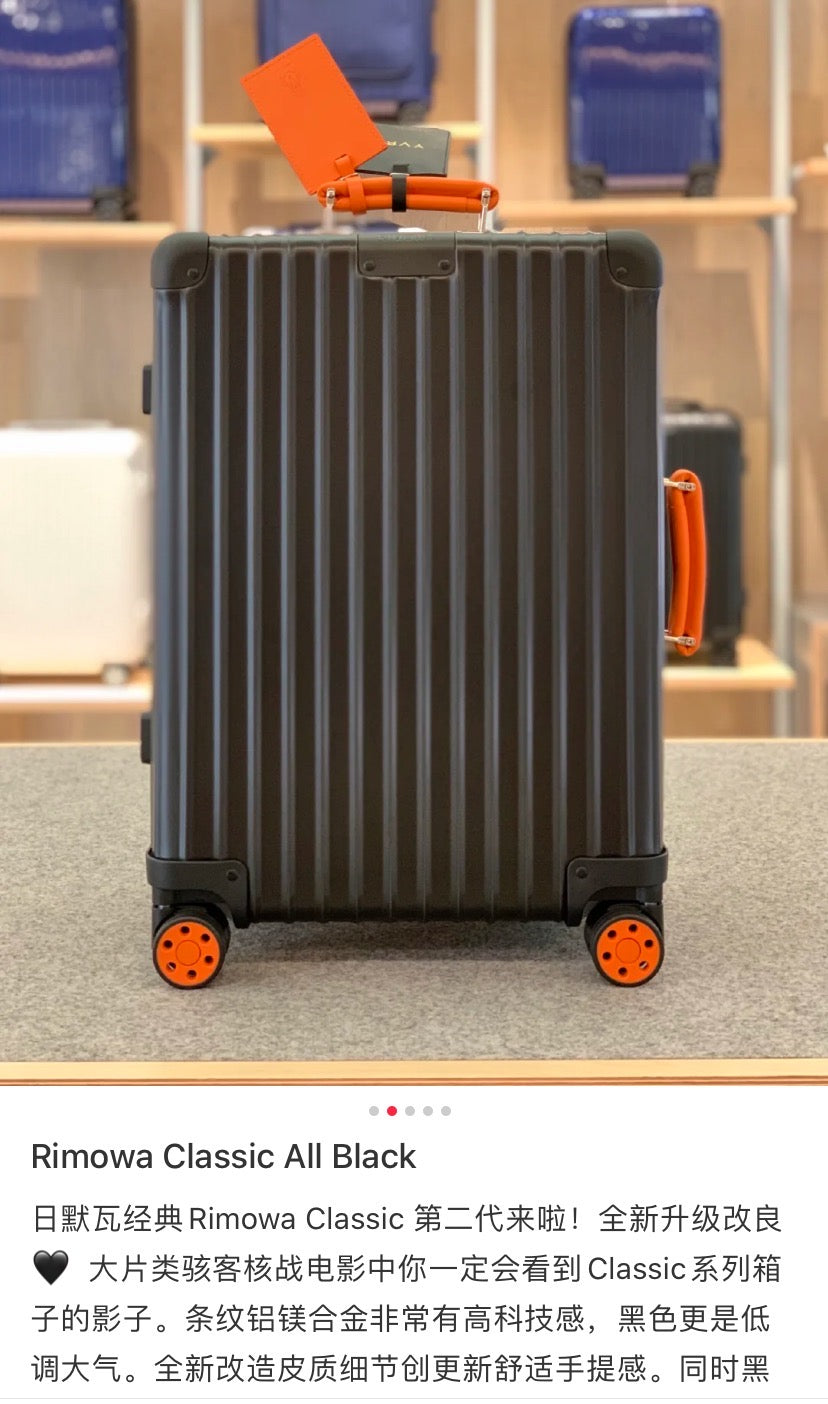 Matte Black Ribbed Hardside Spinner Suitcase with Orange Accents
