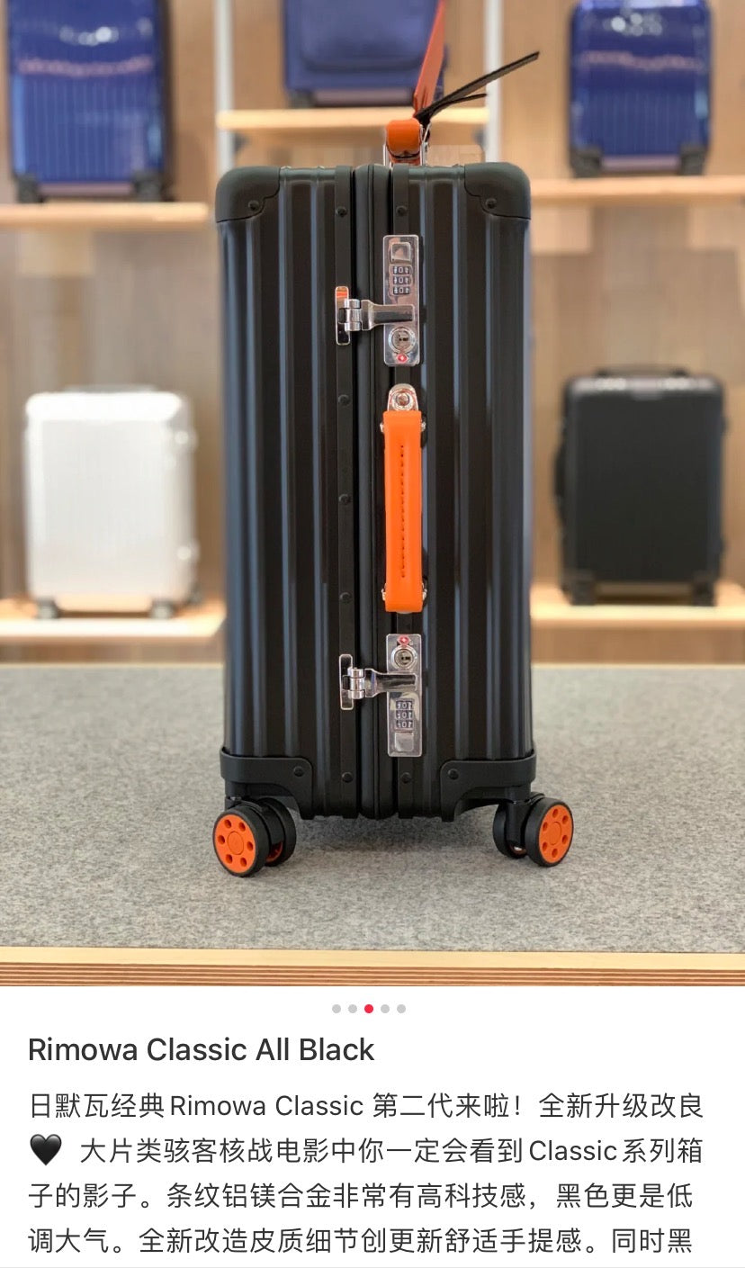 Matte Black Ribbed Hardside Spinner Suitcase with Orange Accents