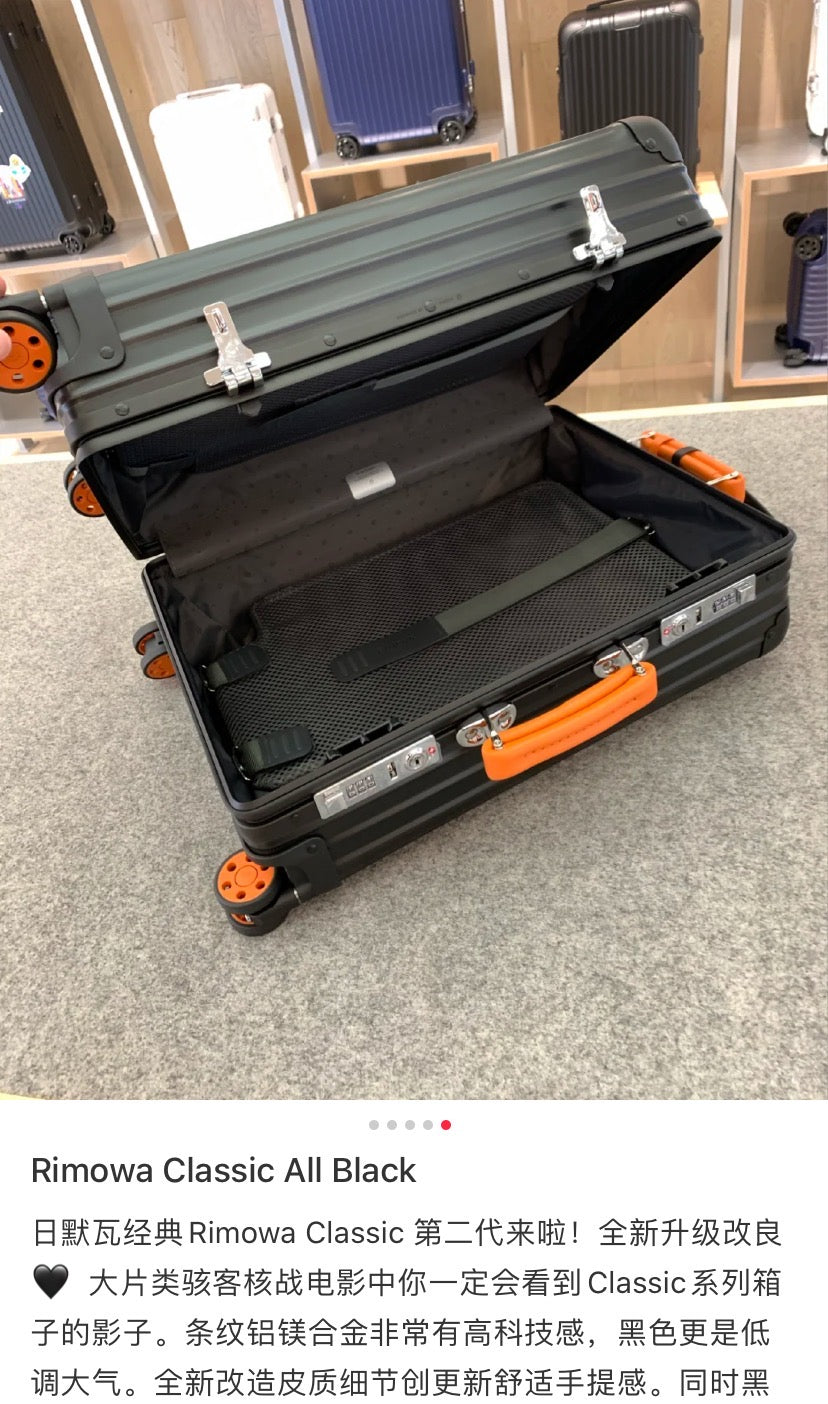 Matte Black Ribbed Hardside Spinner Suitcase with Orange Accents