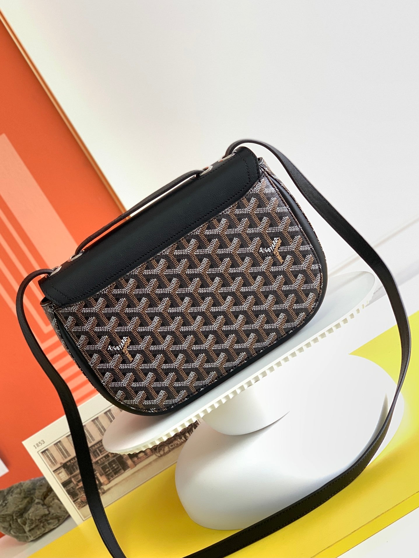 Gogy Black Leather Crossbody Bag with Chevron Monogram Print and Oval Clasp