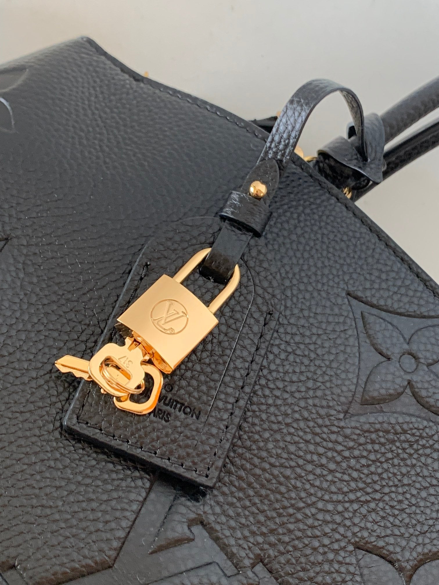 Louis Vuitton Elegant Black Embossed Leather Top Handle Satchel Bag