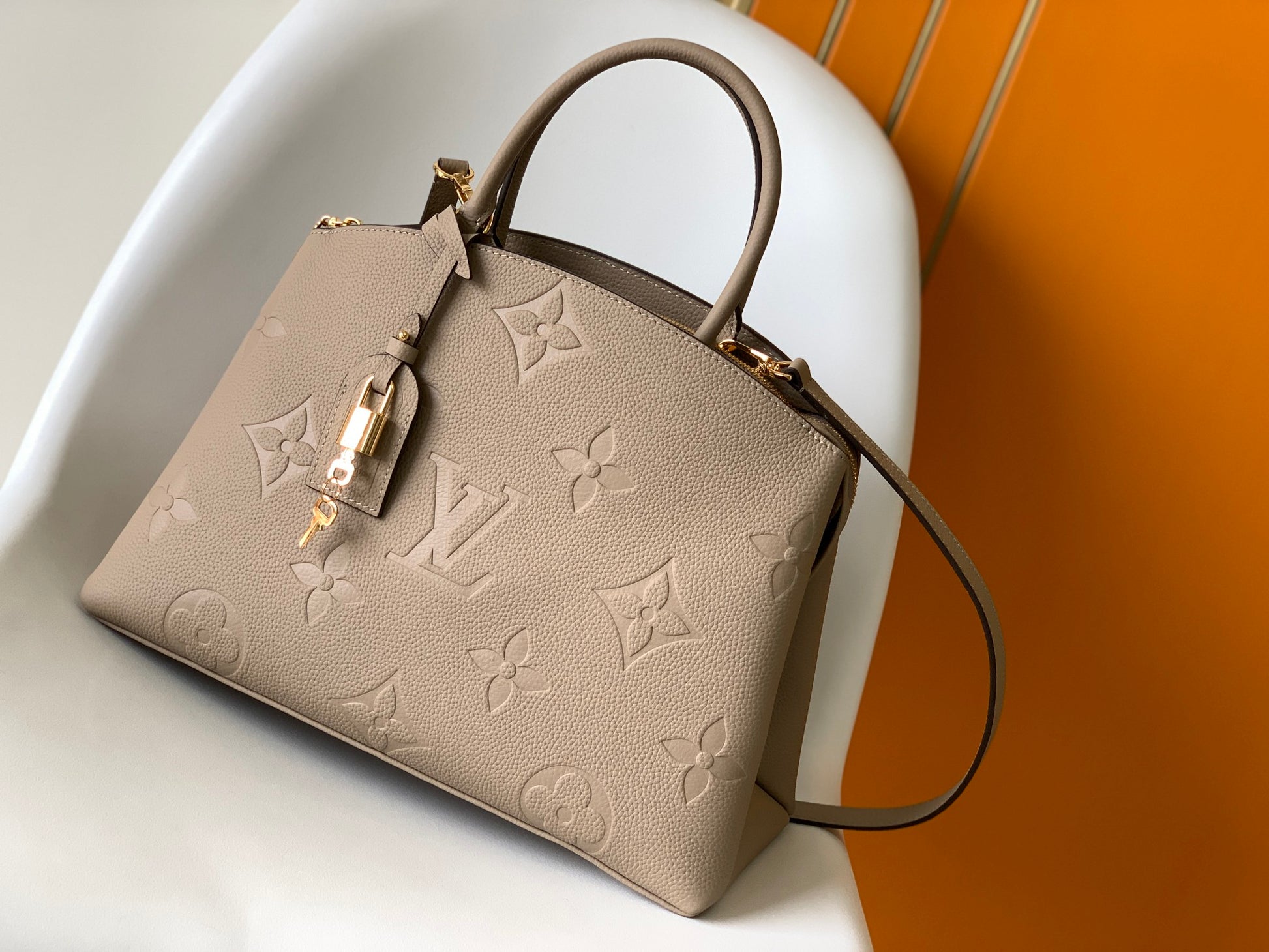 Louis Vuitton Elegant Taupe Embossed Leather Satchel Handbag with Lock Charm