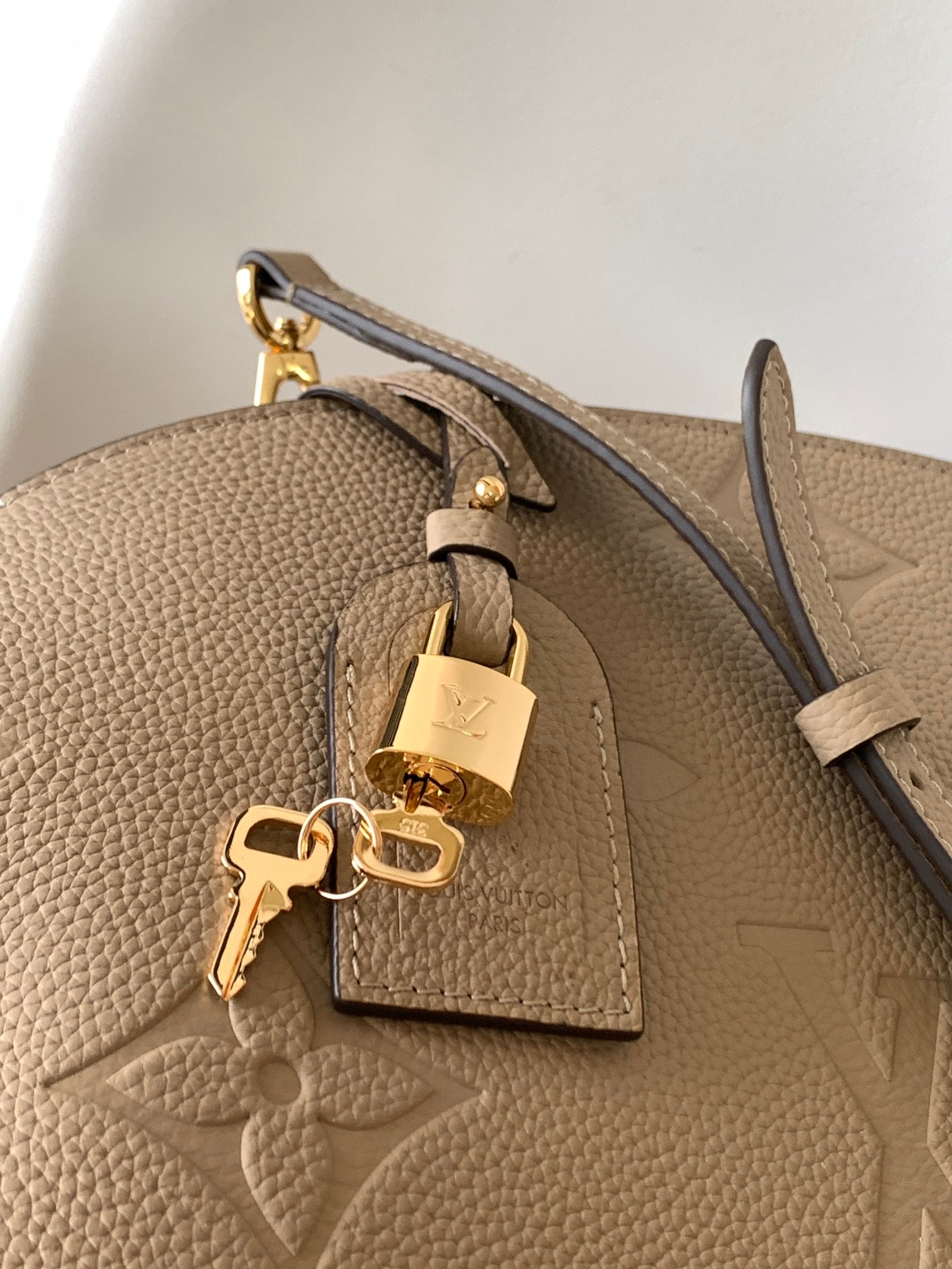 Louis Vuitton Elegant Taupe Embossed Leather Satchel Handbag with Lock Charm