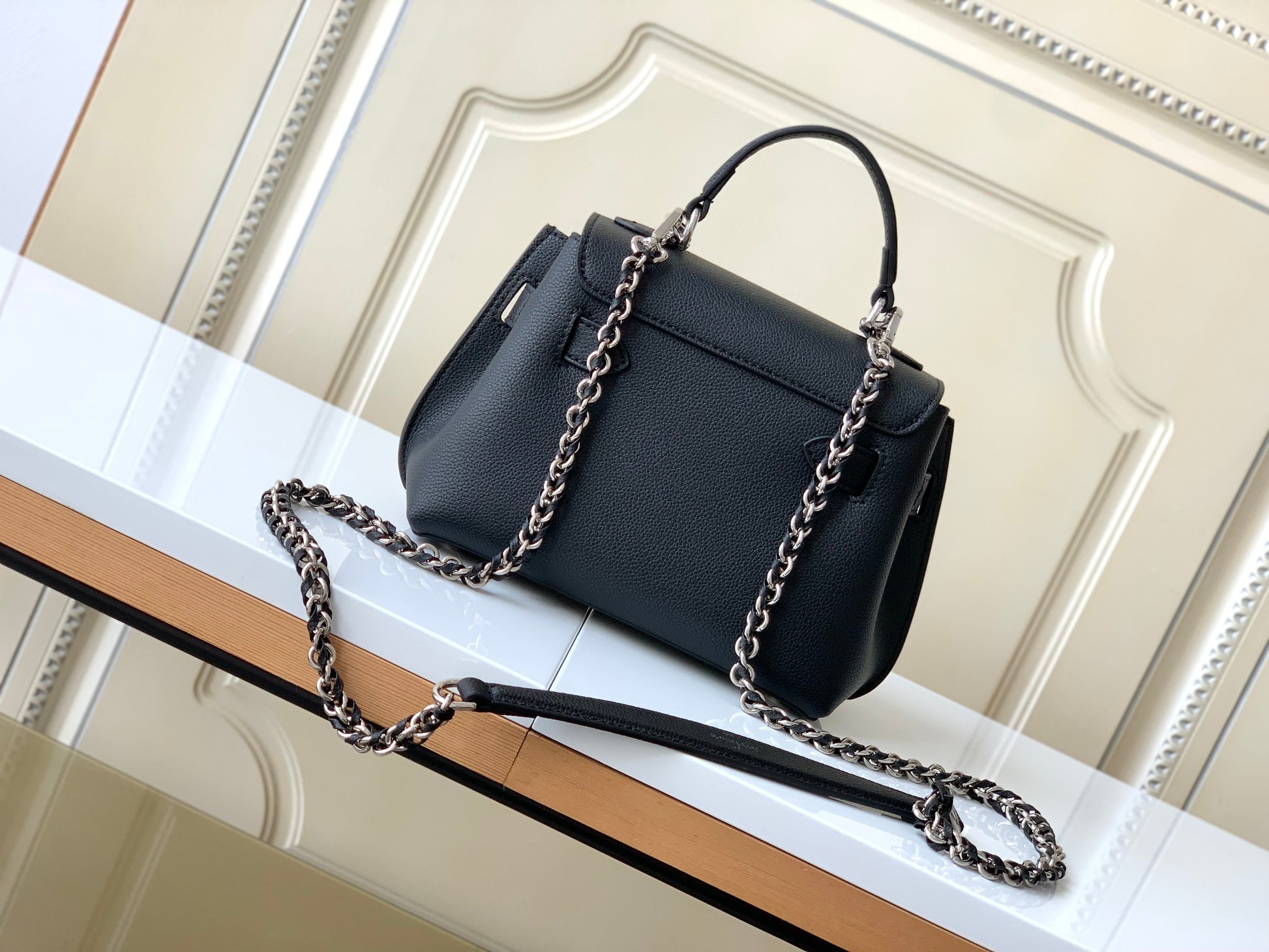 Louis Vuitton Elegant Black Leather Top Handle Handbag with Silver Metal Clasp
