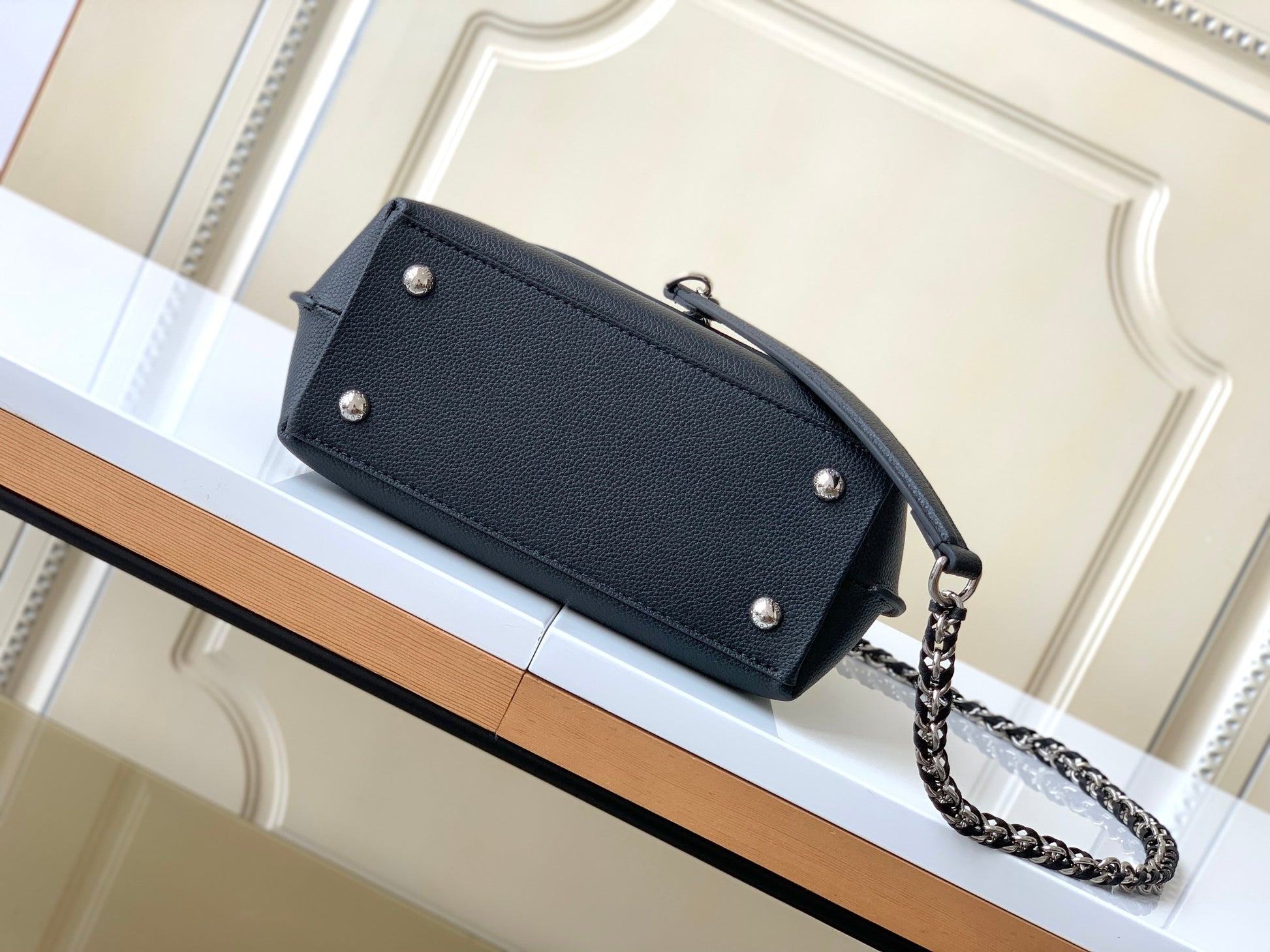 Louis Vuitton Elegant Black Leather Top Handle Handbag with Silver Metal Clasp