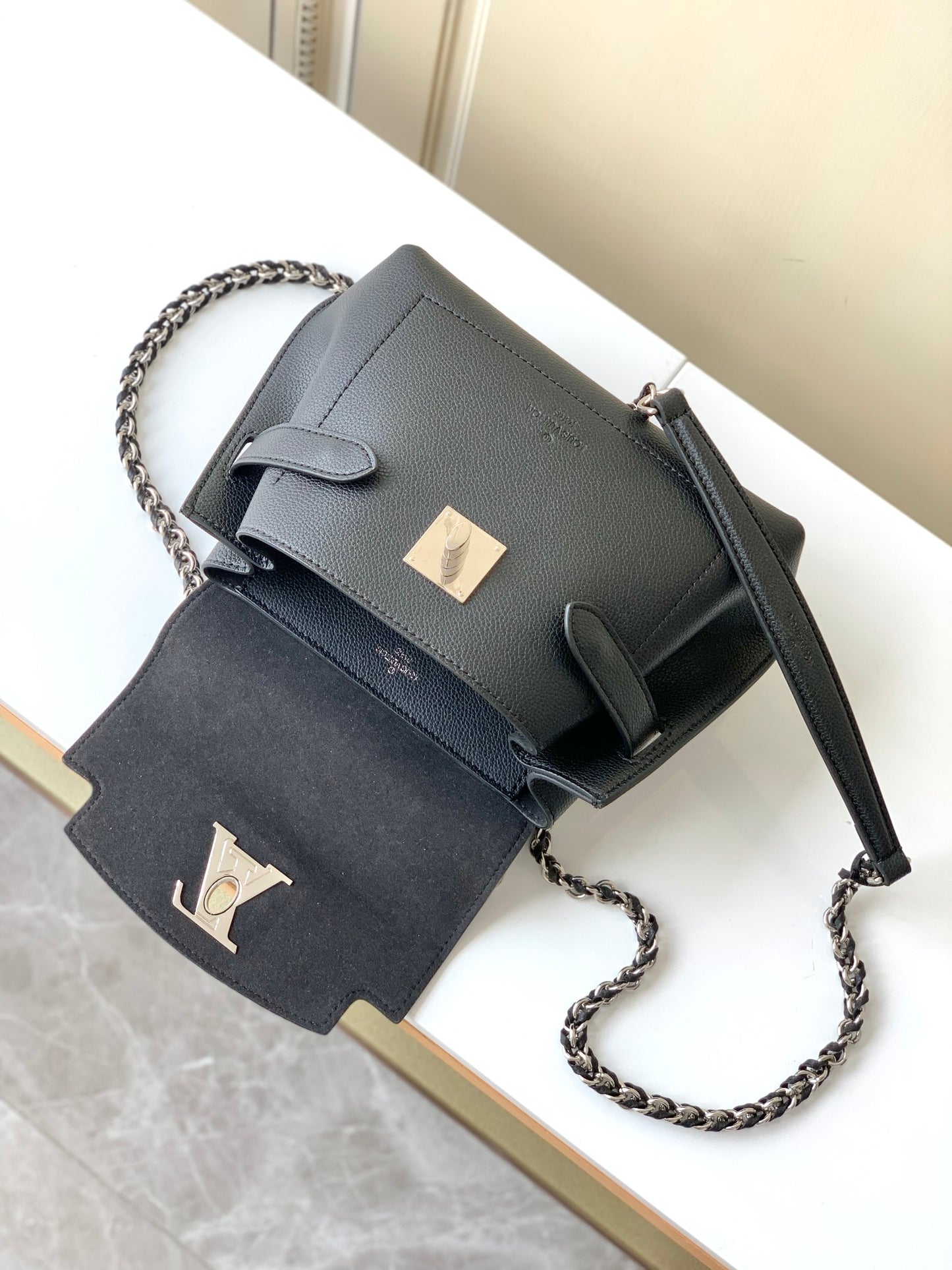 Louis Vuitton Elegant Black Leather Top Handle Handbag with Silver Metal Clasp