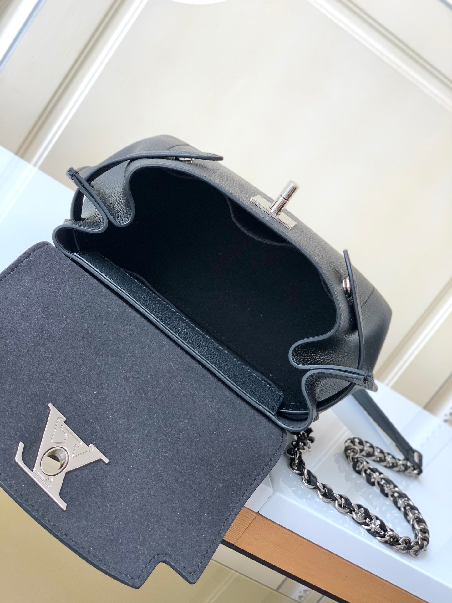 Louis Vuitton Elegant Black Leather Top Handle Handbag with Silver Metal Clasp