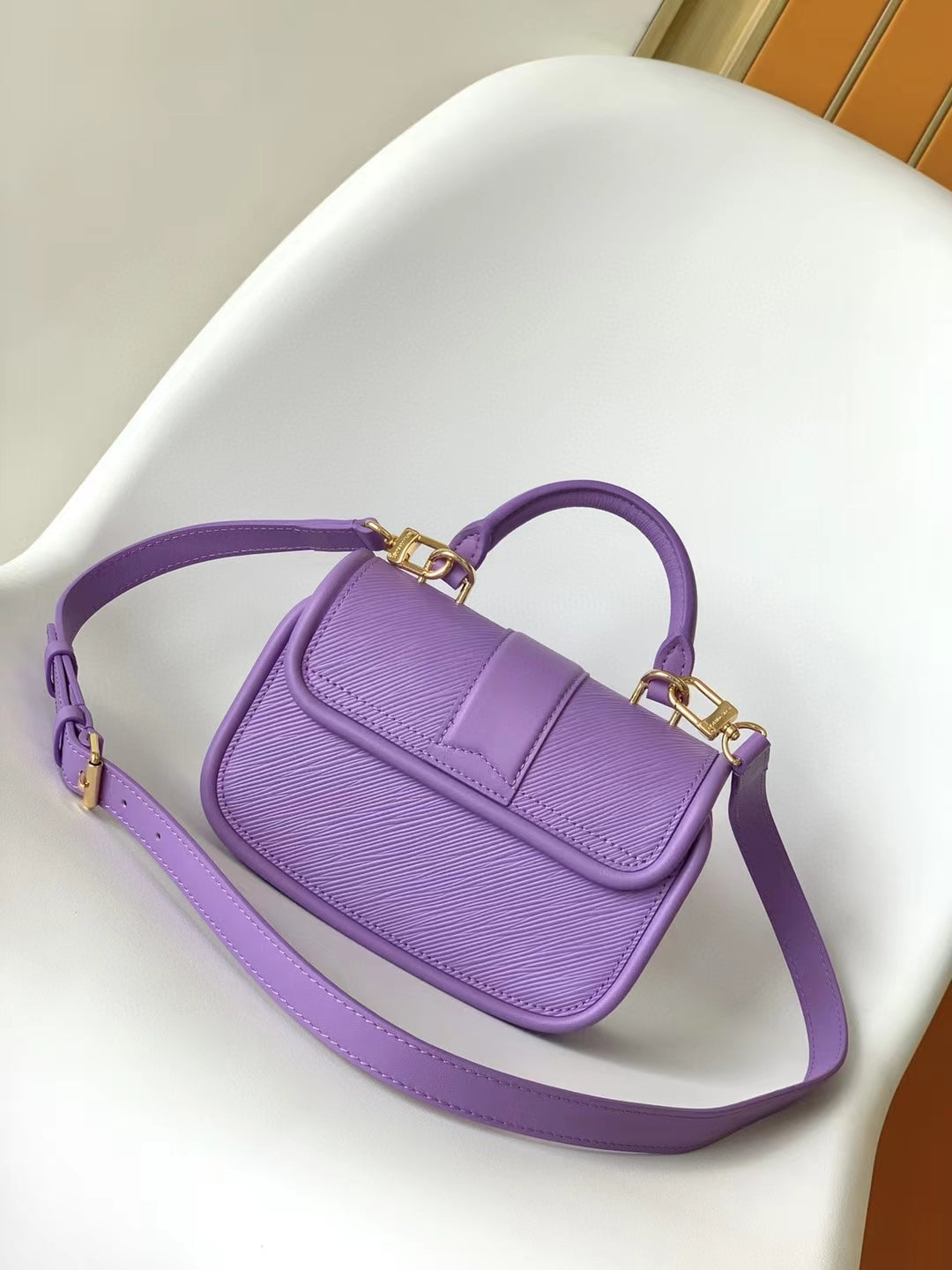Mini Purple Textured Leather Handbag with Gold-Tone Hardware and Top Handle