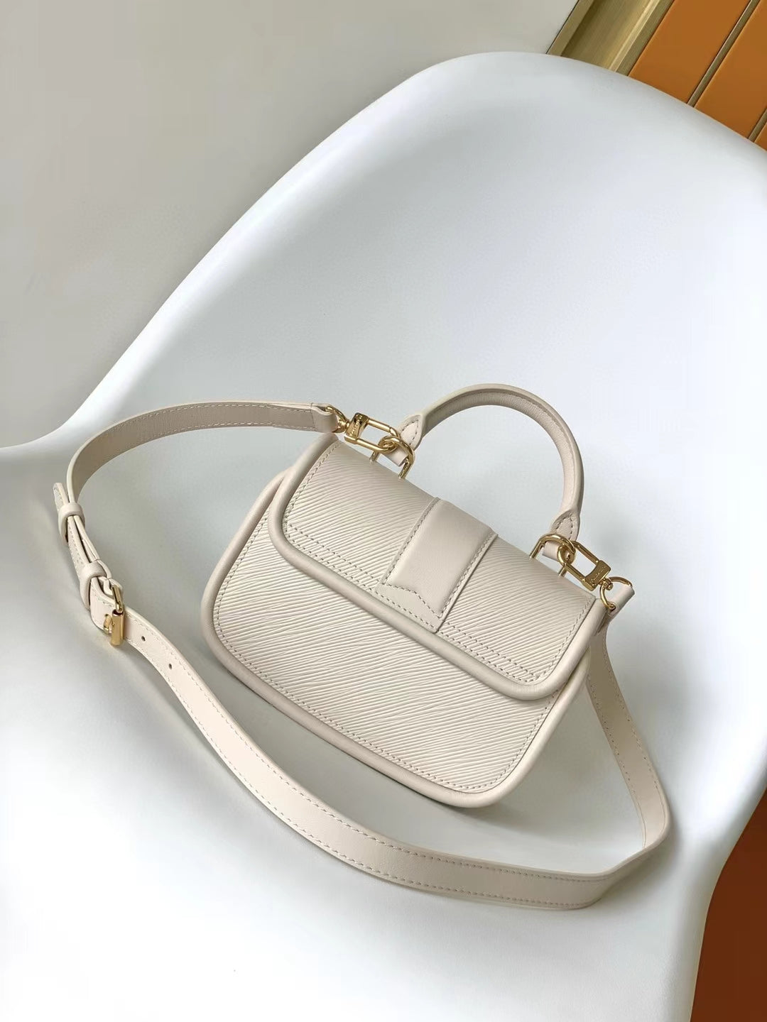 Elegant Beige Leather Micro Top Handle Bag with Gold Hardware
