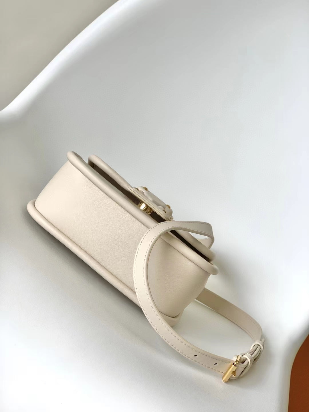 Louis Vuitton Elegant Beige Mini Top Handle Bag with Gold Lock Clasp