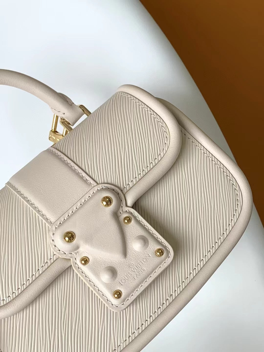 Louis Vuitton Elegant Beige Mini Top Handle Bag with Gold Lock Clasp