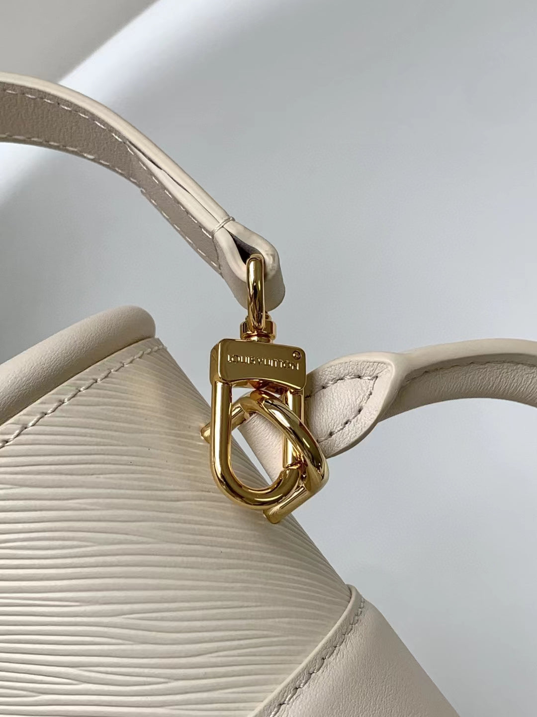 Louis Vuitton Elegant Beige Mini Top Handle Bag with Gold Lock Clasp