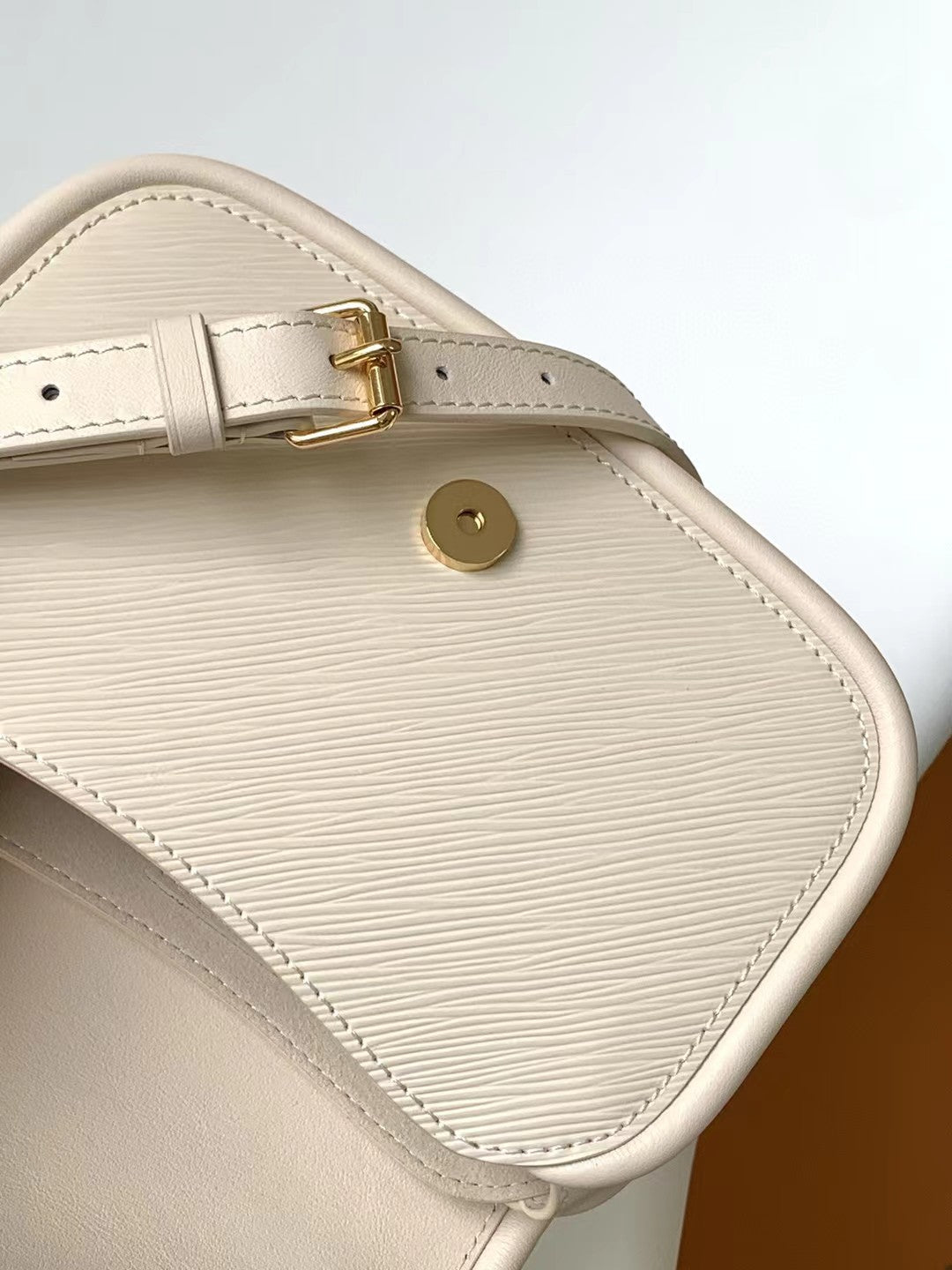 Louis Vuitton Elegant Beige Mini Top Handle Bag with Gold Lock Clasp