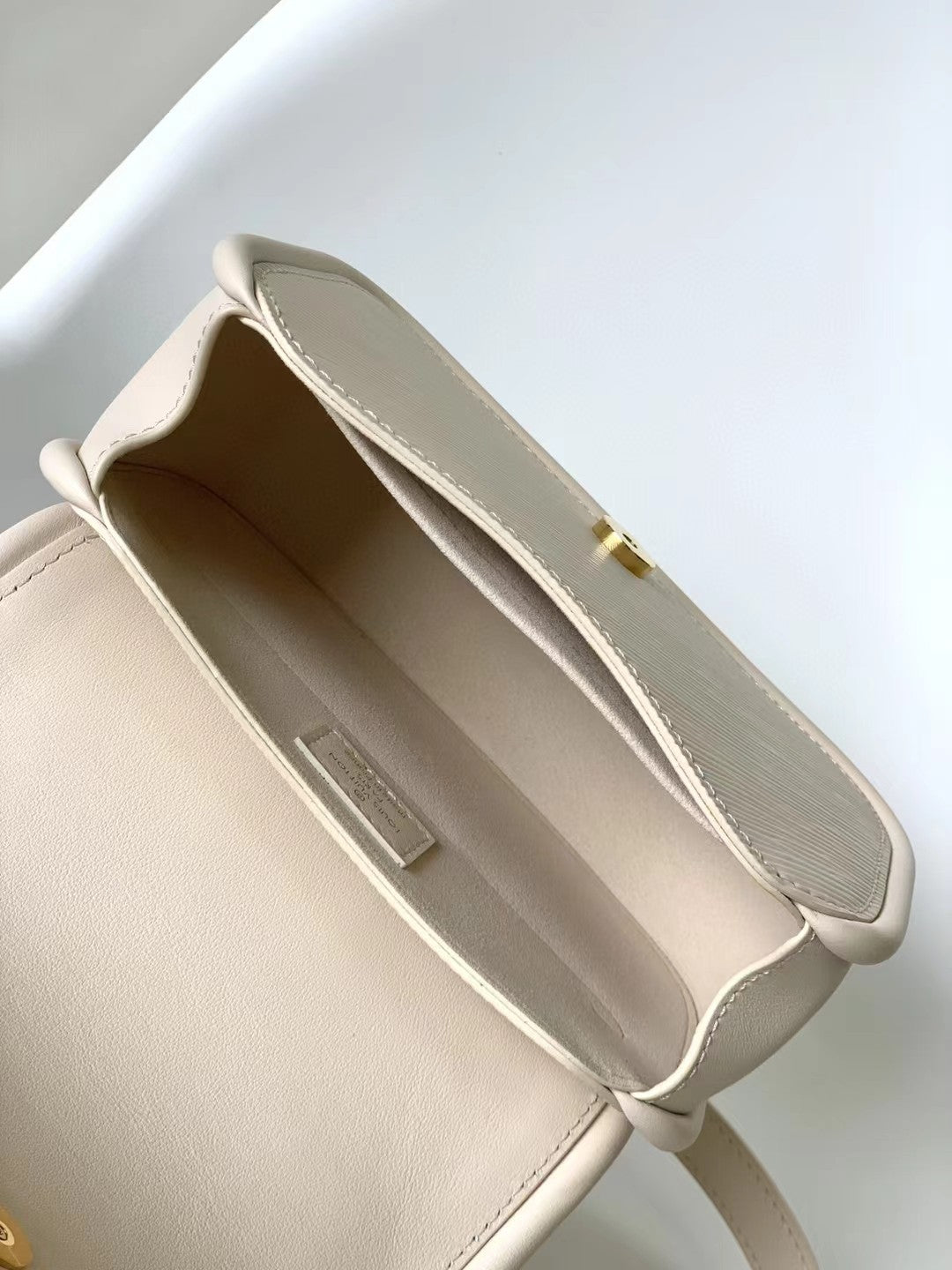 Louis Vuitton Elegant Beige Mini Top Handle Bag with Gold Lock Clasp
