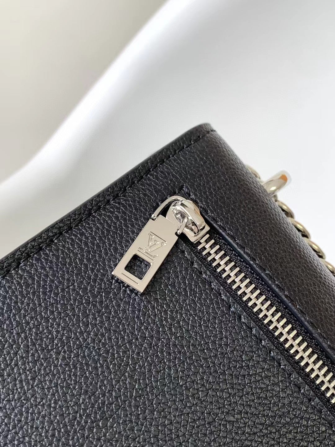 Louis Vuitton Elegant Black Leather Envelope Handbag with Silver Chain Strap