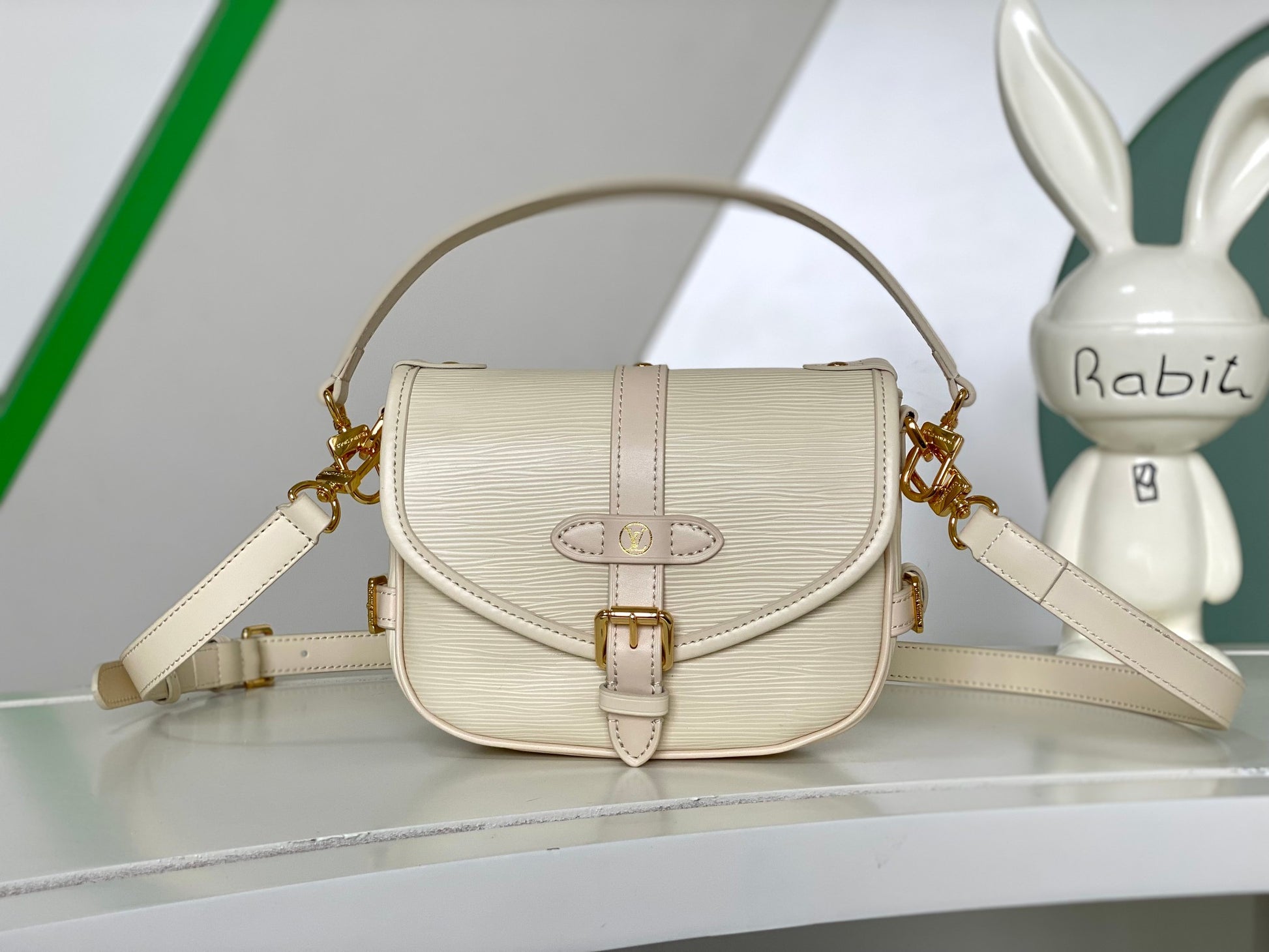 Louis Vuitton Elegant Pale Pink Leather Crossbody Saddle Bag with Gold Hardware