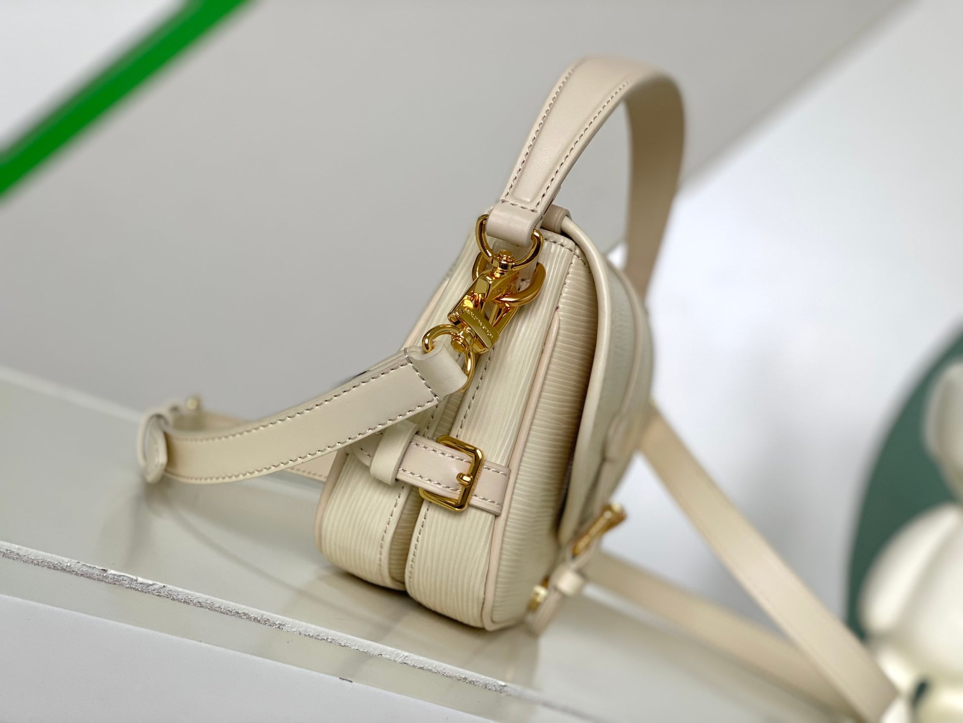 Louis Vuitton Elegant Pale Pink Leather Crossbody Saddle Bag with Gold Hardware