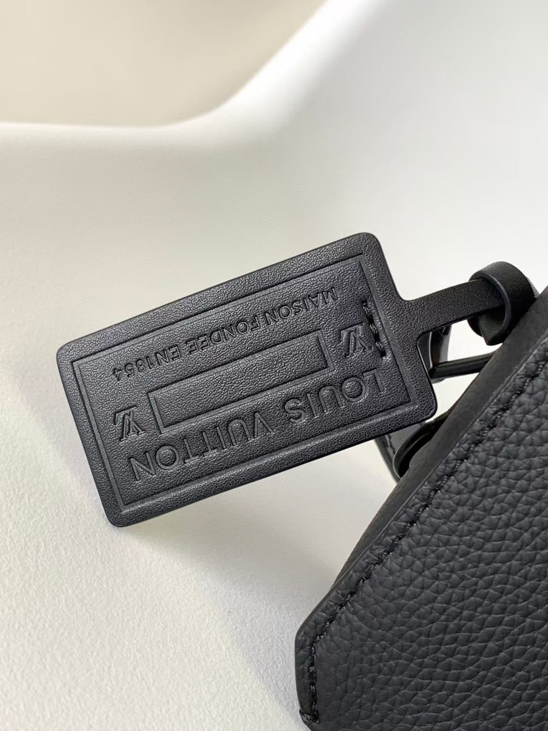 Louis Vuitton Sleek Black Leather Crossbody Bag with Adjustable Strap