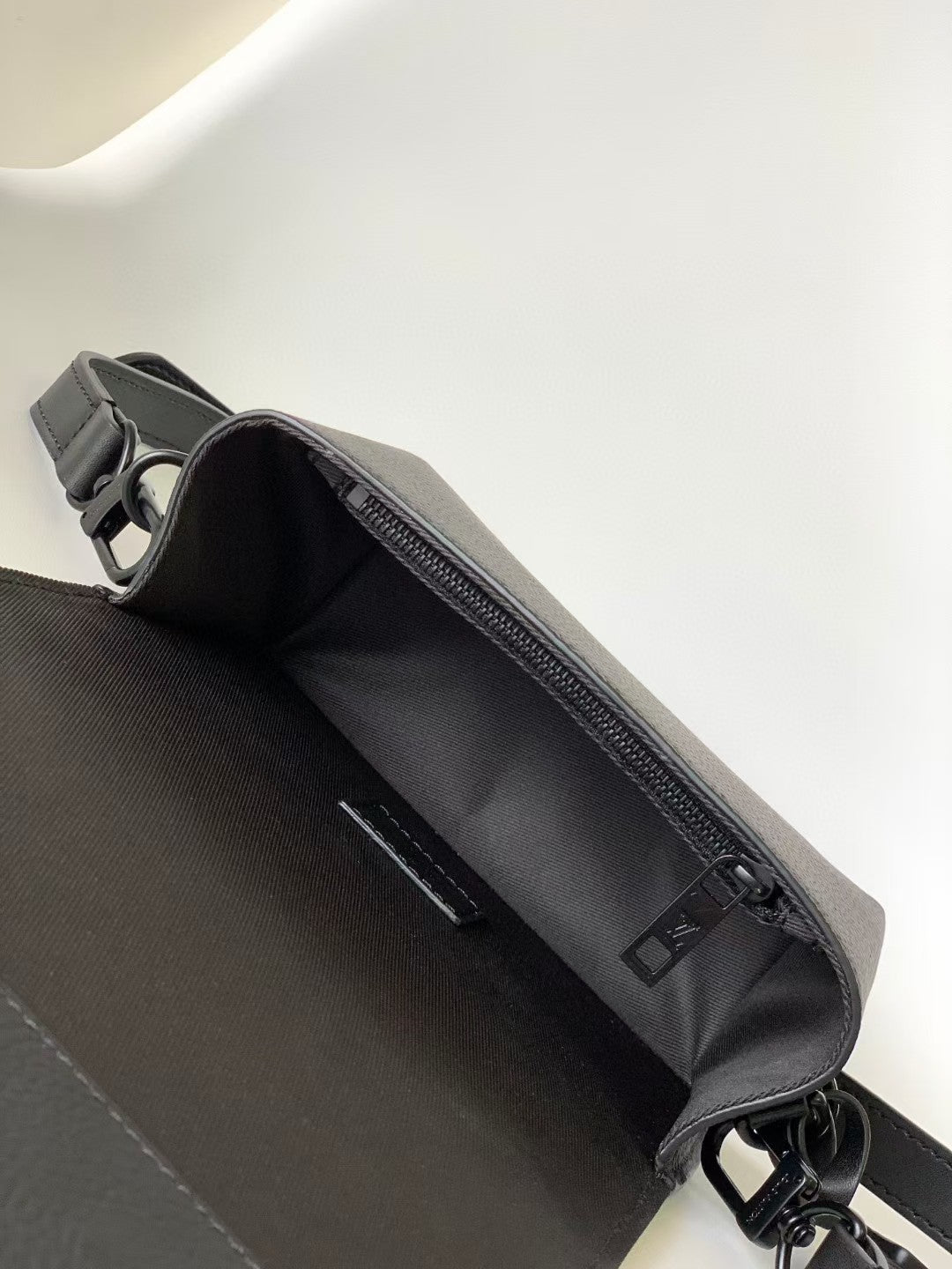 Louis Vuitton Sleek Black Leather Crossbody Bag with Adjustable Strap
