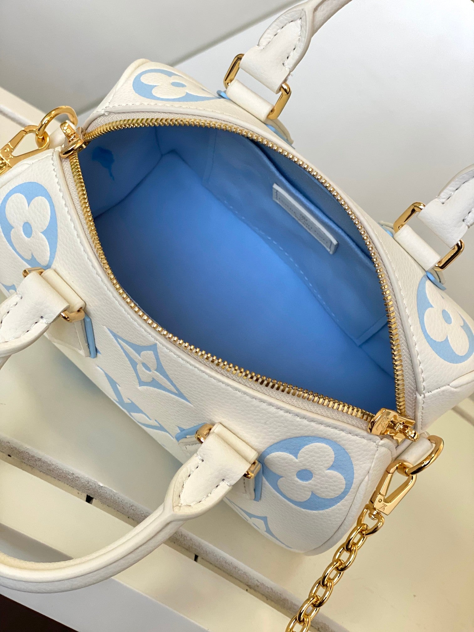 Louis Vuitton Cream and Pastel Blue Embossed Leather Mini Duffle Handbag