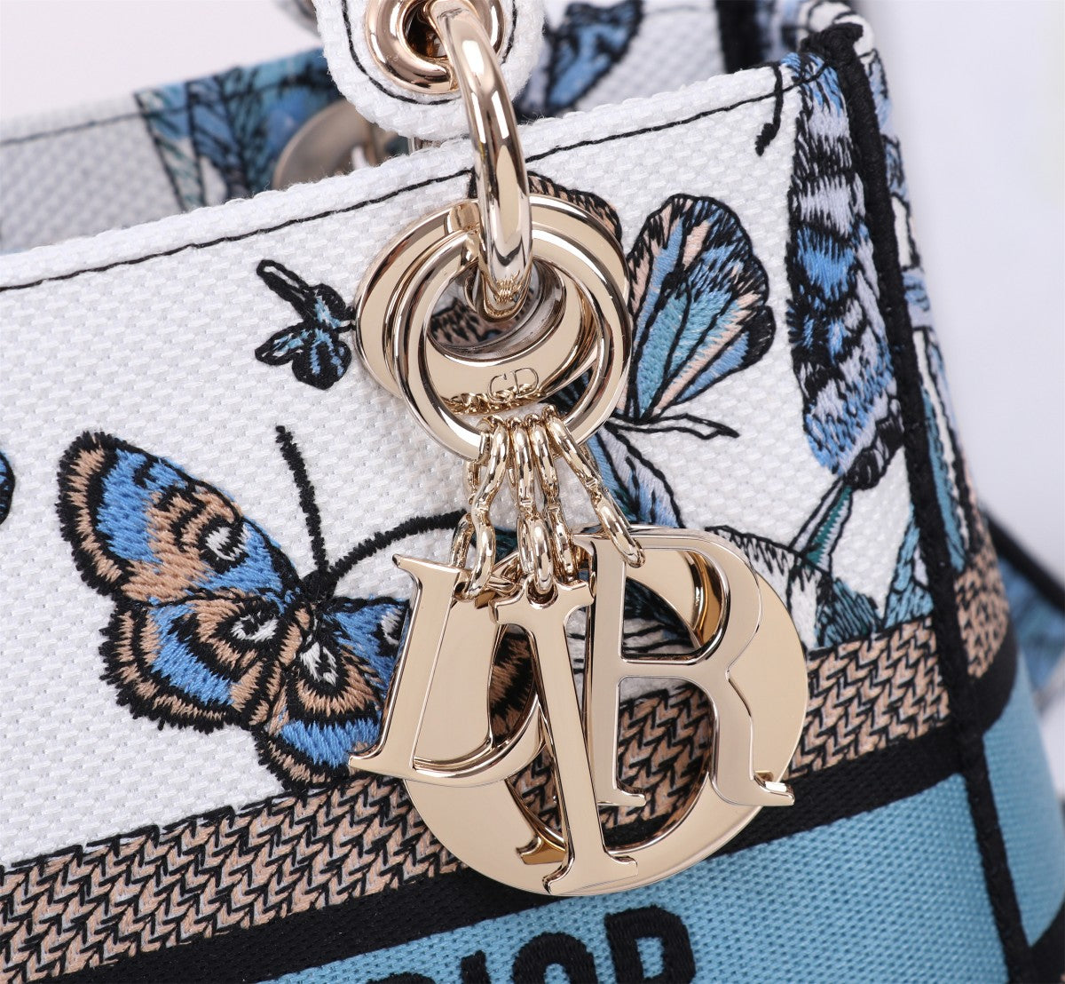 Dior Elegant Blue Butterfly Print Canvas Handbag with Shoulder Strap