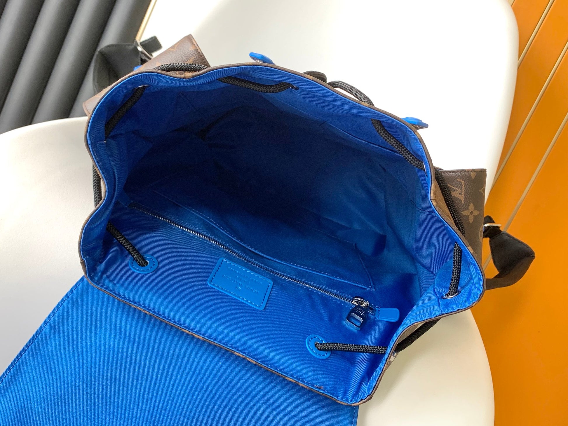 Louis Vuitton Luxury Monogram Canvas Backpack with Bright Blue Leather Straps