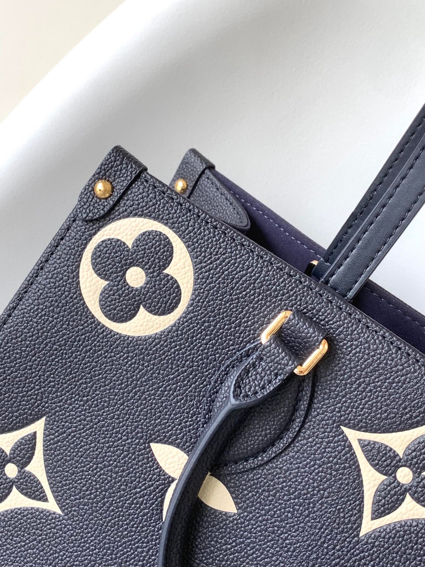 Louis Vuitton Elegant Navy Blue Leather Tote Bag with Floral Monogram Pattern
