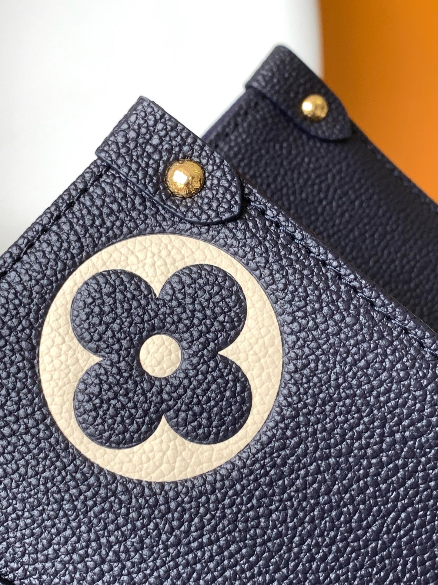 Louis Vuitton Elegant Navy Blue Leather Tote Bag with Floral Monogram Pattern