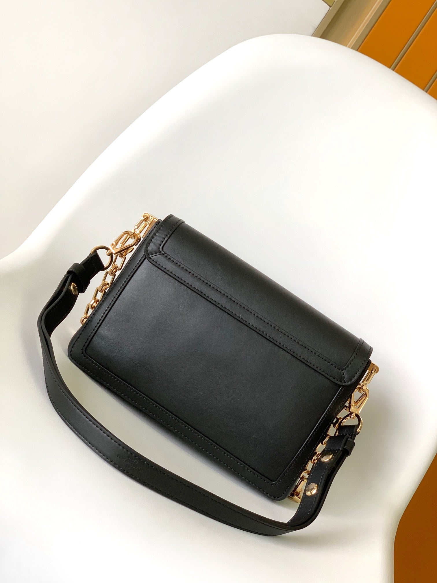 Louis Vuitton Elegant Black Faux Leather Crossbody Bag with Gold Chain Strap
