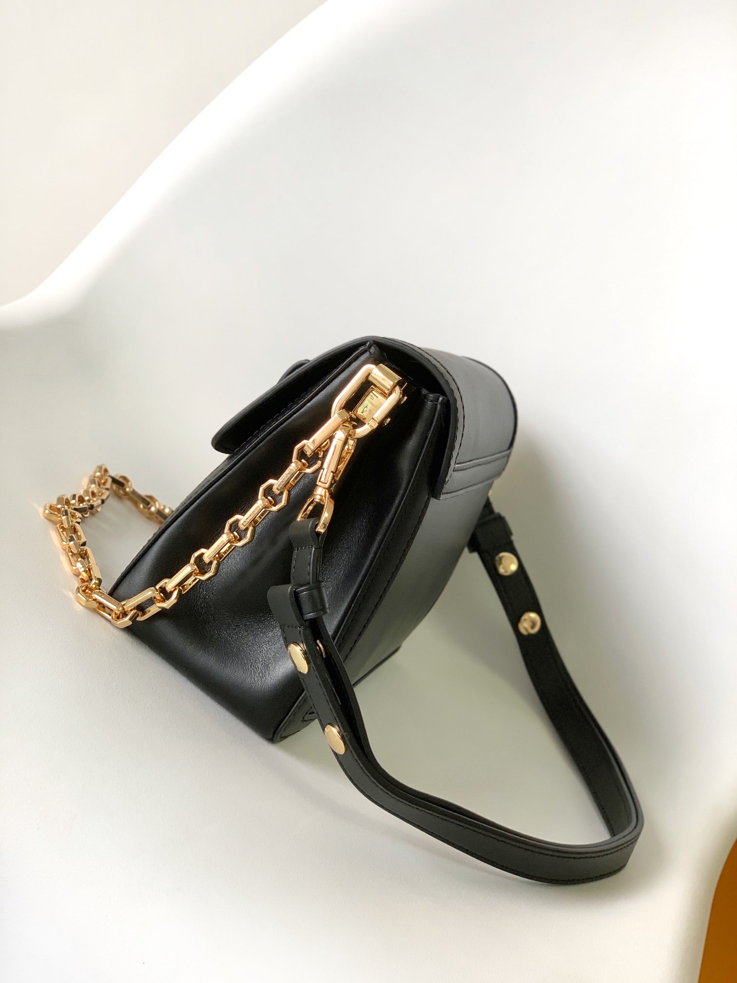 Louis Vuitton Elegant Black Faux Leather Crossbody Bag with Gold Chain Strap