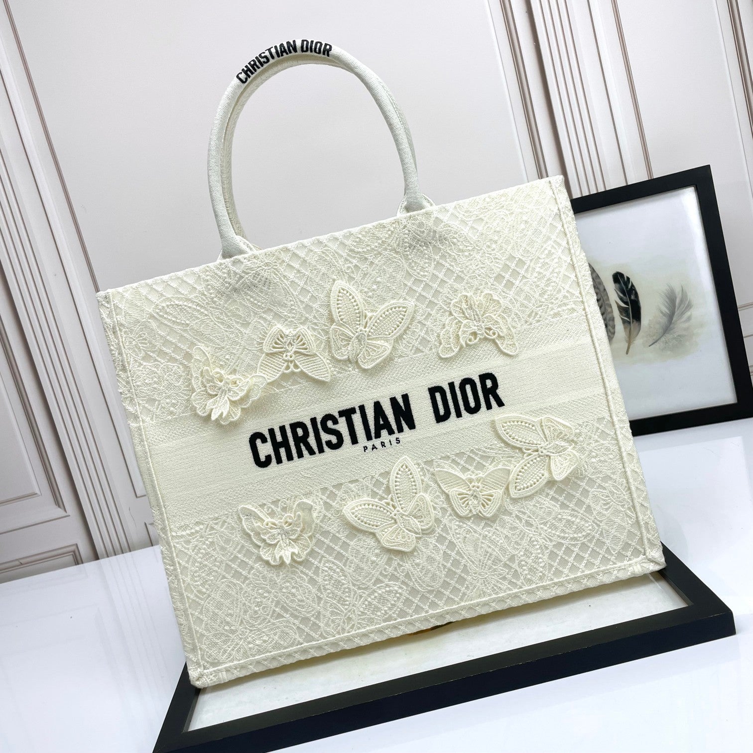 Dior Elegant Cream Canvas Handbag with 3D Textured Butterfly Appliqué