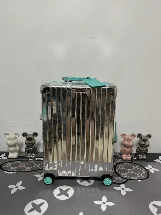 Metallic Silver Ribbed Hard Shell Carry-On Suitcase with Teal Accents