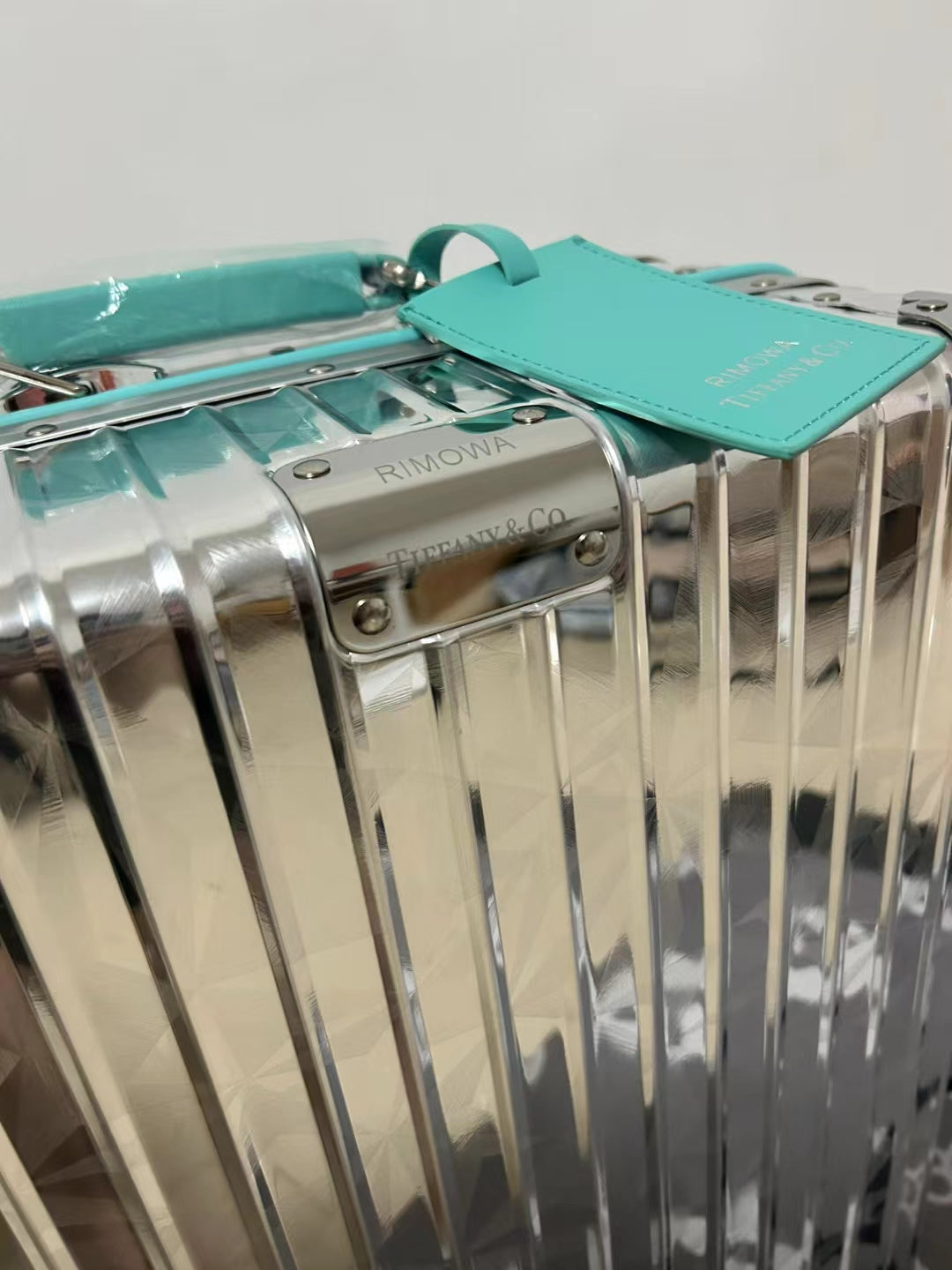 Metallic Silver Ribbed Hard Shell Carry-On Suitcase with Teal Accents