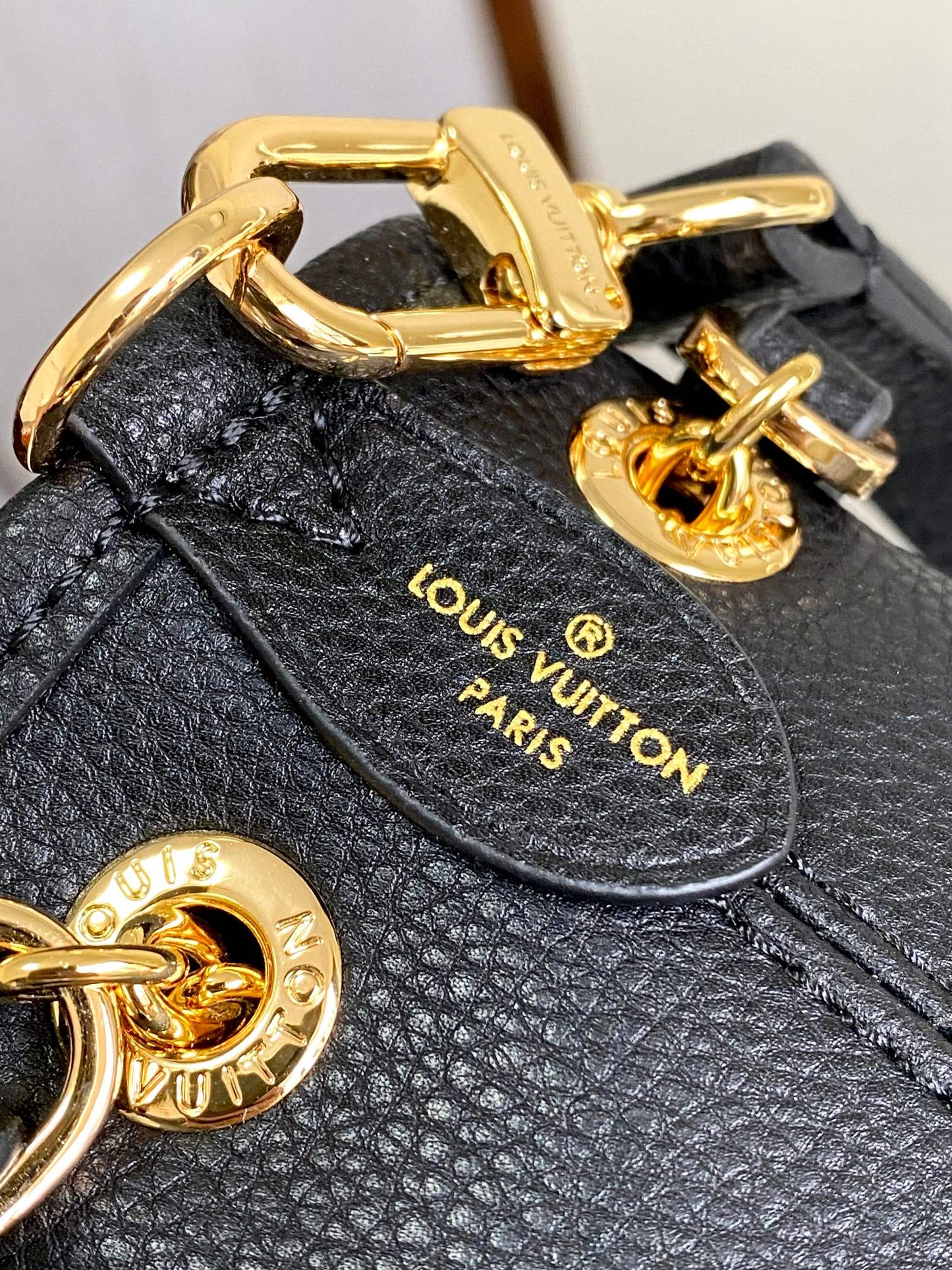 Louis Vuitton Elegant Black Embossed Leather Drawstring Shoulder Bag