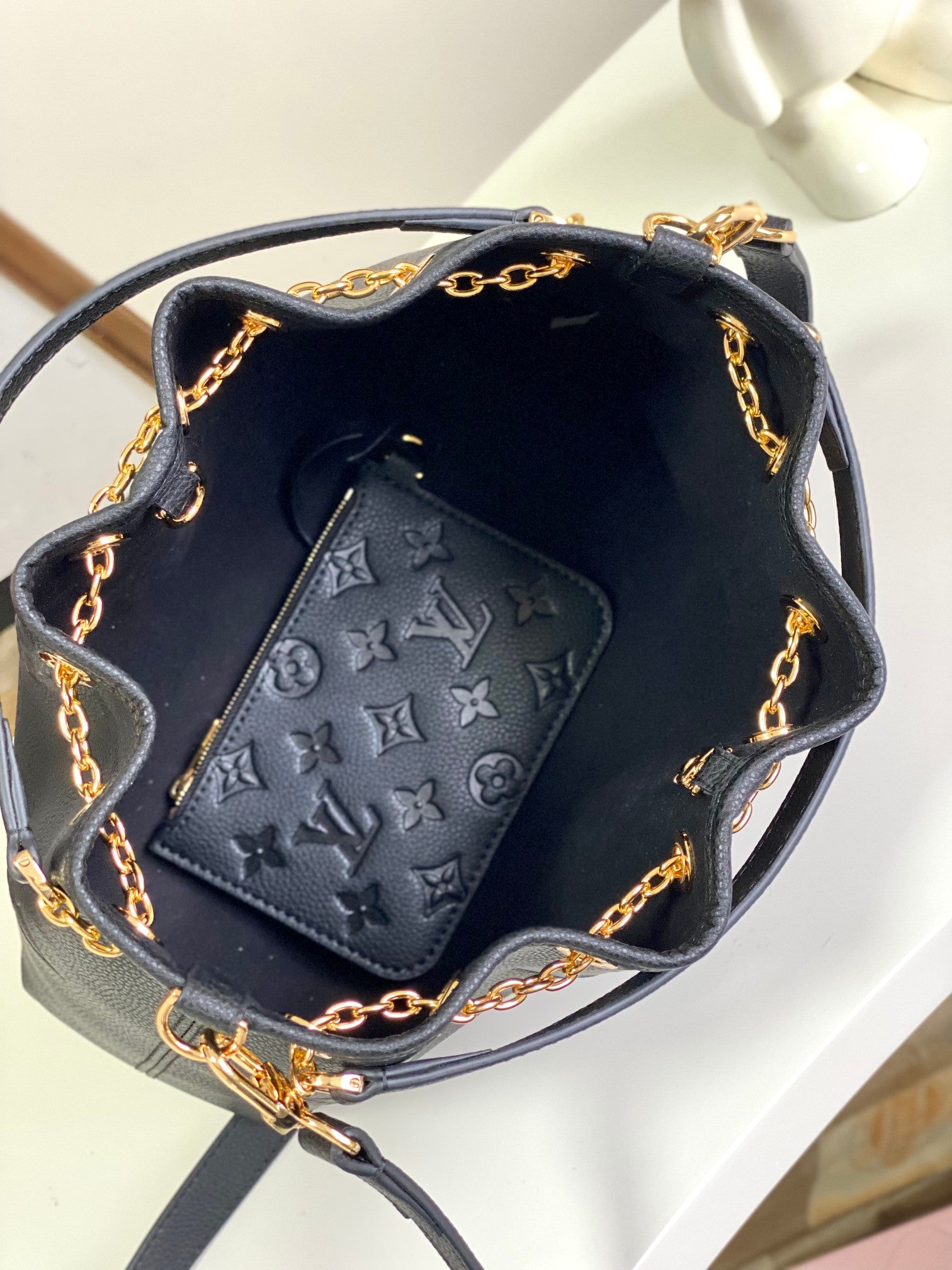 Louis Vuitton Elegant Black Embossed Leather Drawstring Shoulder Bag